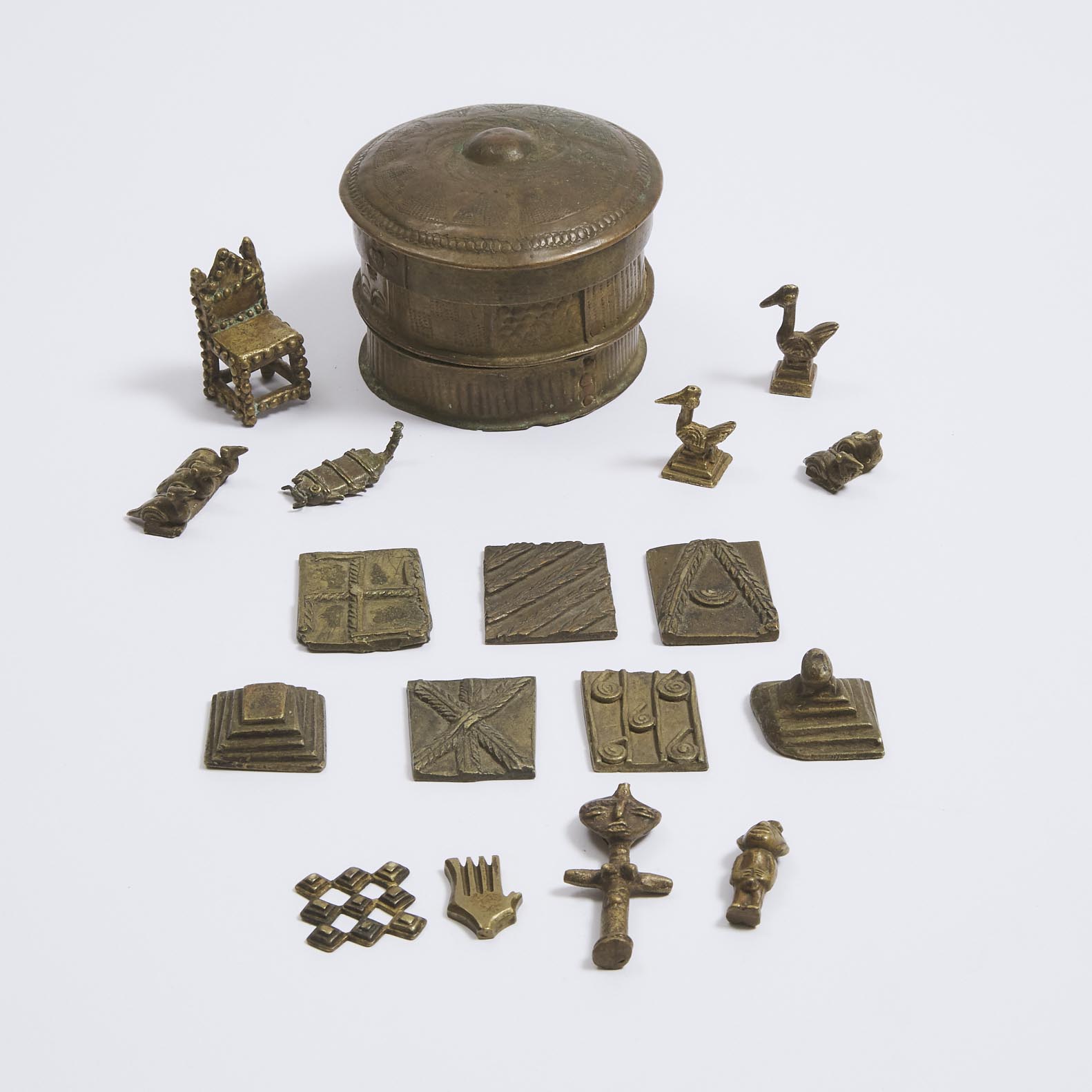 17 Akan/Ashanti Goldweights together with an Ashanti Brass Forowa Container, Ghana, West Africa, 19th/20th century