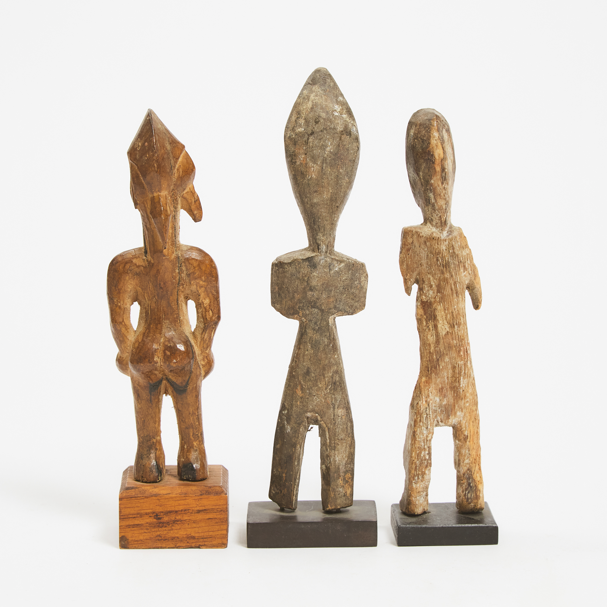 Senufo Female Figure, South Africa together with two unidentified African figures, 20th century, two possibly 19th century