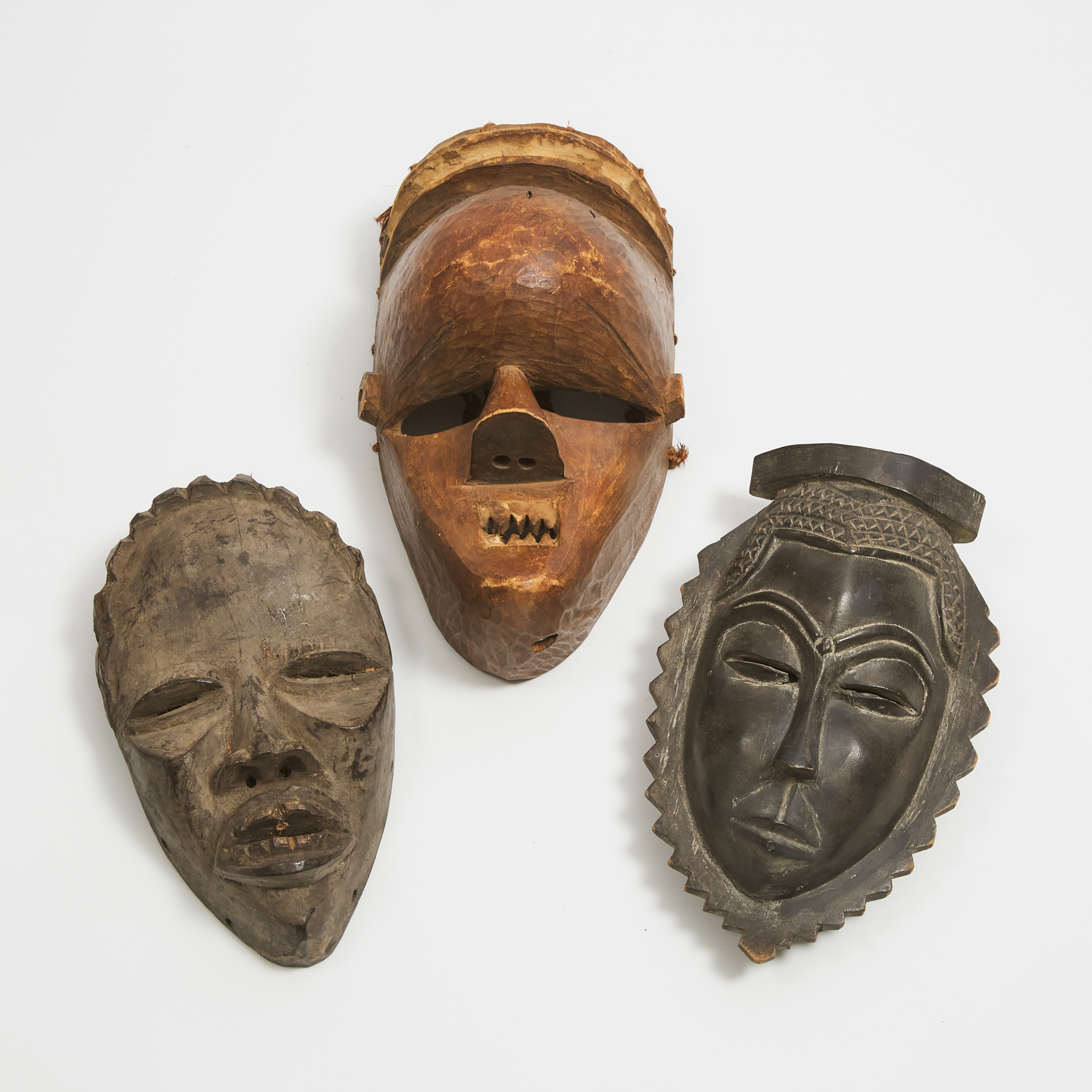 Salampasu Mask, Lulua River, Democratic Republic of Congo, togwther with a Dan and a Baule/Guro Mask, Ivory Coast, late 20th century