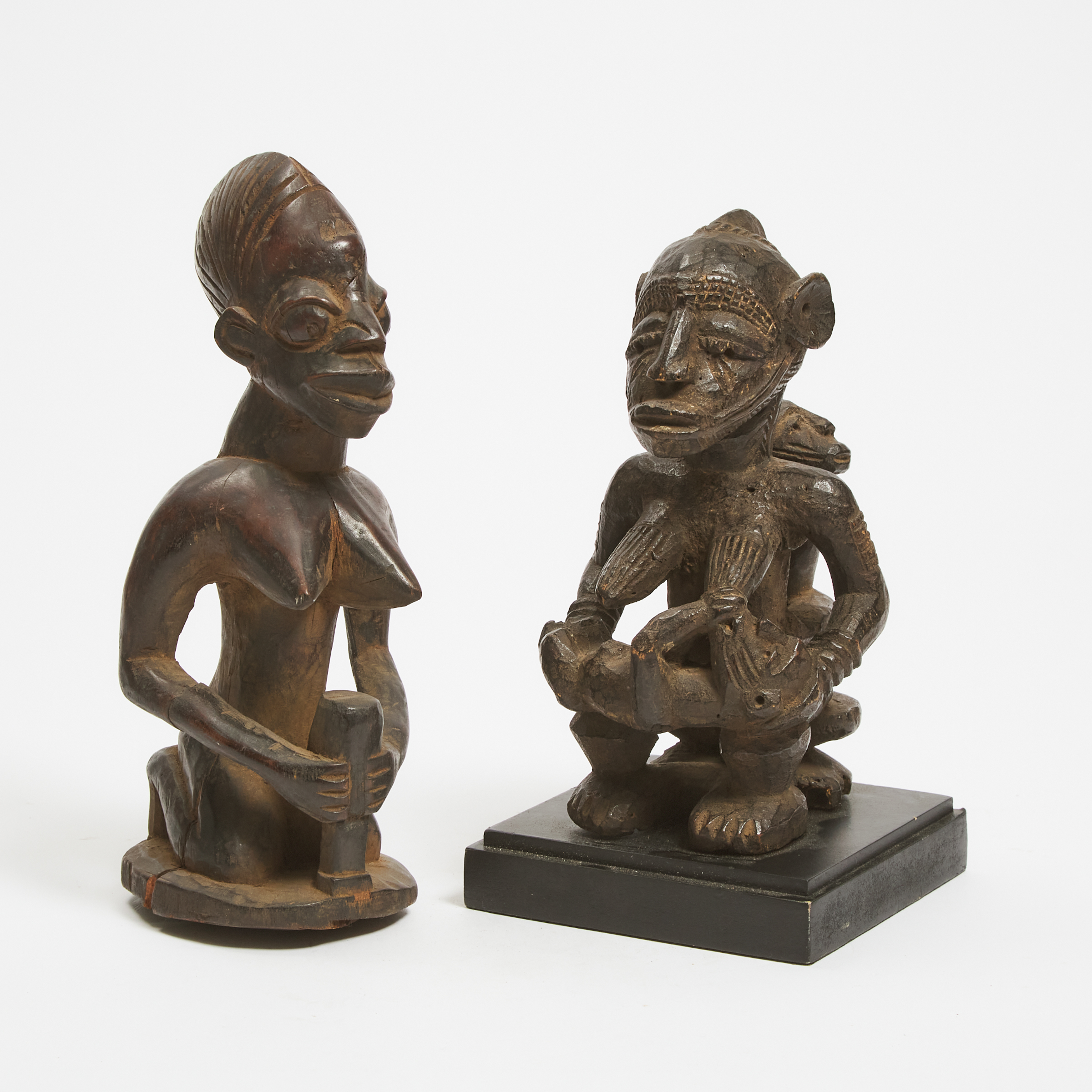 Unidentified Seated Maternity Figure, possibly Baga together with a kneeling Yoruba female figure, 20th century