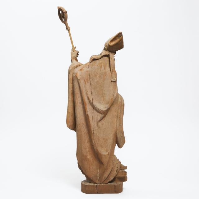 Gothic Style Carved Oak Figure of a Bishop with Crozier, Books and Grapes, Josef 'Peppi' Rifesser (Italian, 1921-2020), mid 20th century
