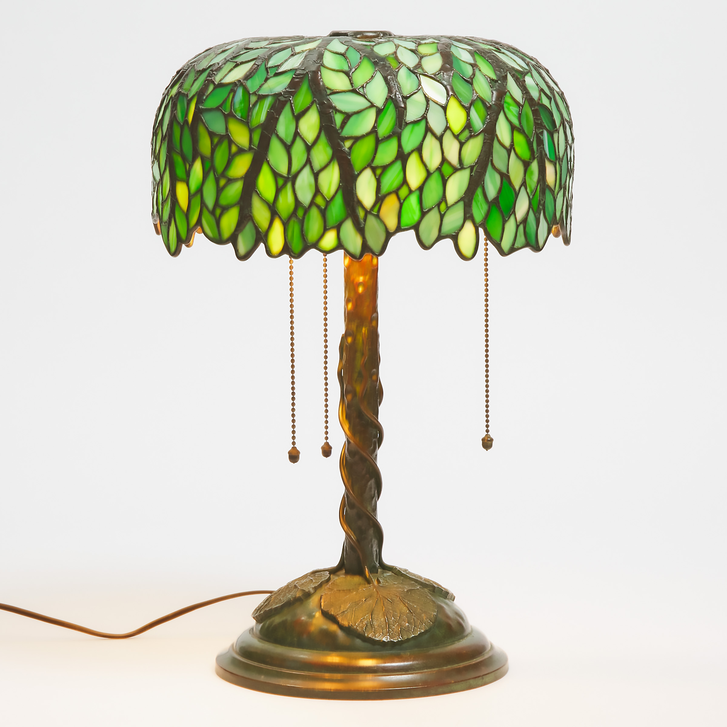 American Patinated Bronze and Leaded Mosaic Slag Glass Tree Form Table Lamp, early 20th century