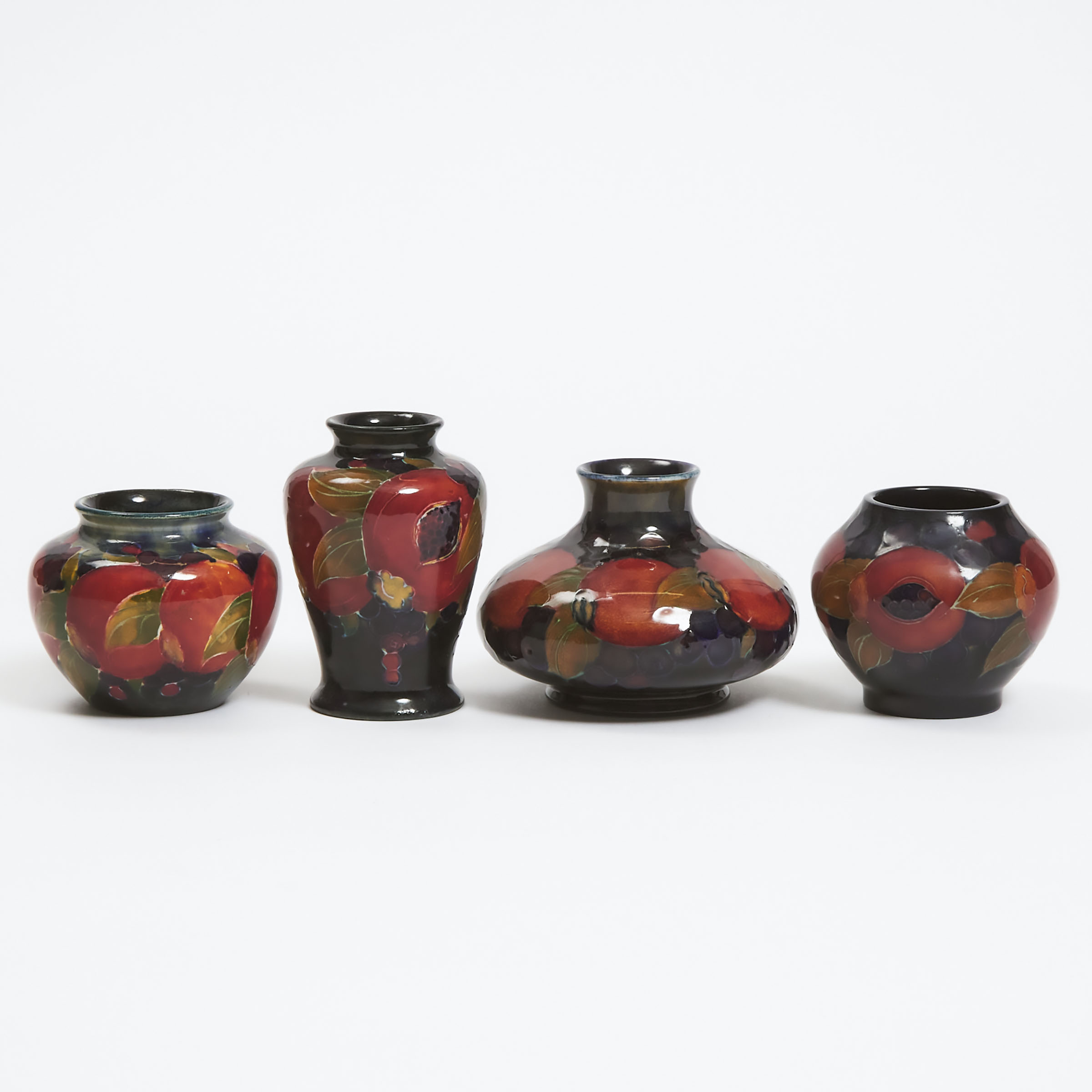 Four Moorcroft Small Pomegranate Vases, c.1920-25