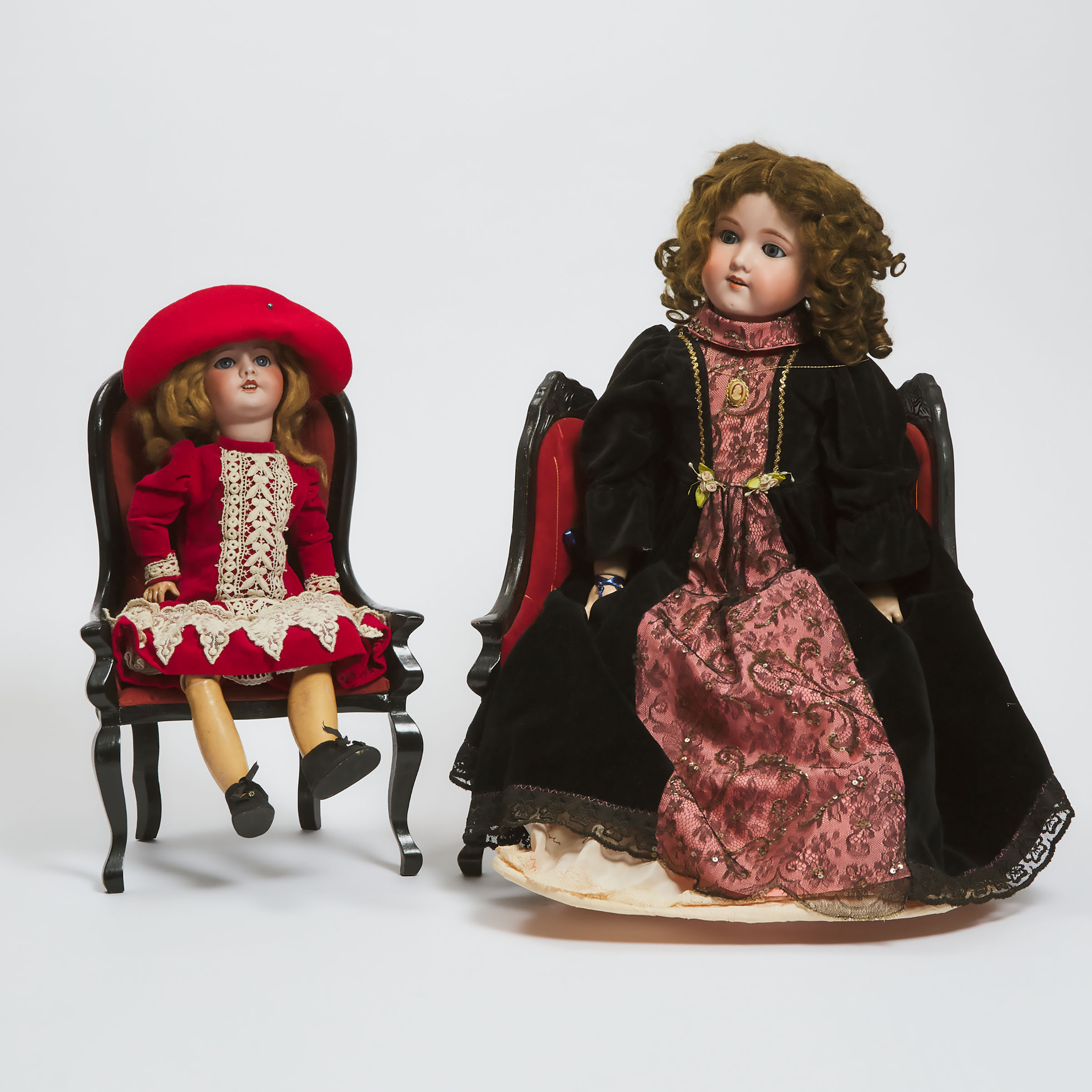 Two Continental Bisque Headed Dolls with Associated Furniture early 20th century