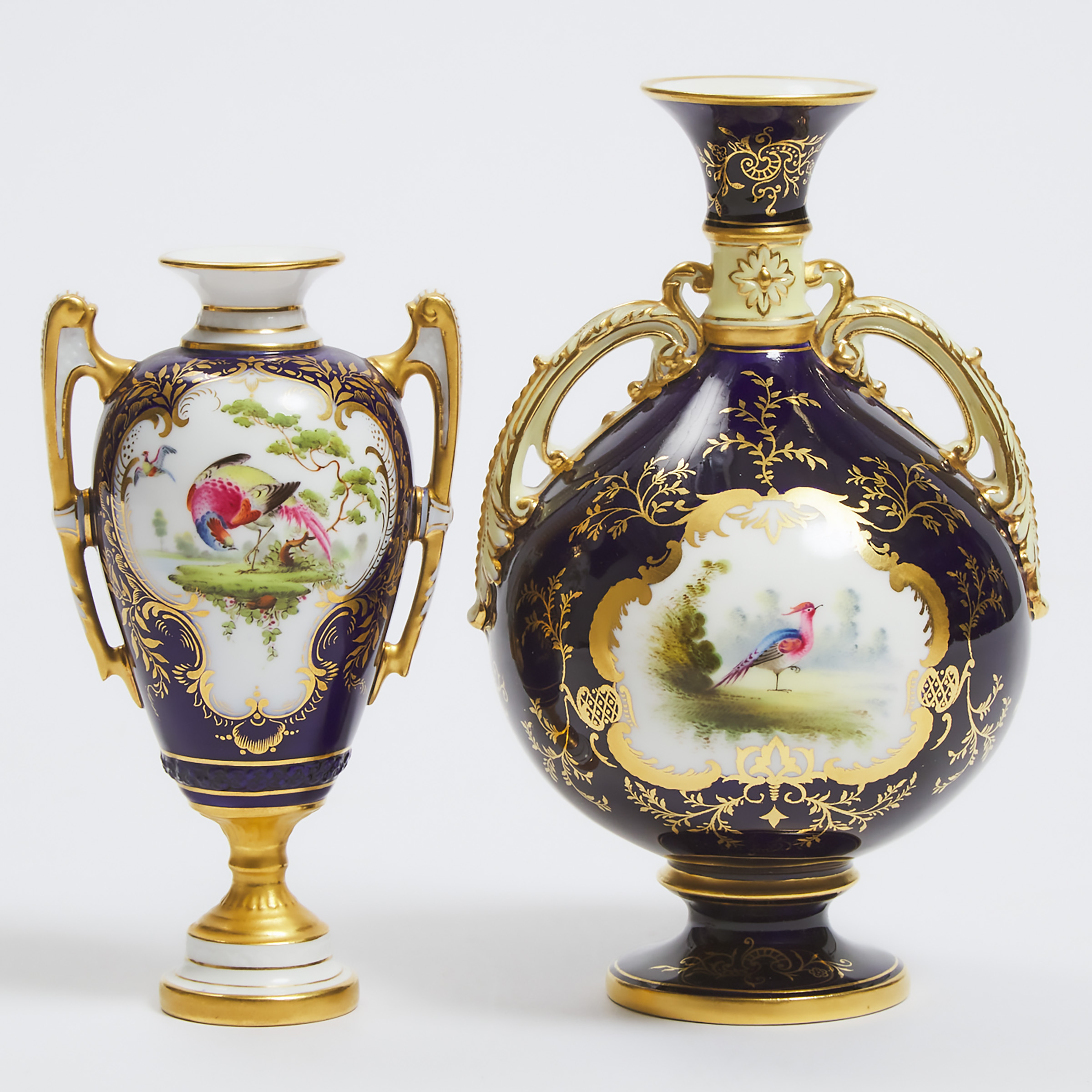 Two Coalport or Royal Worcester Exotic Bird Painted Two-Handled Cabinet Vases, c.1900 and 1896