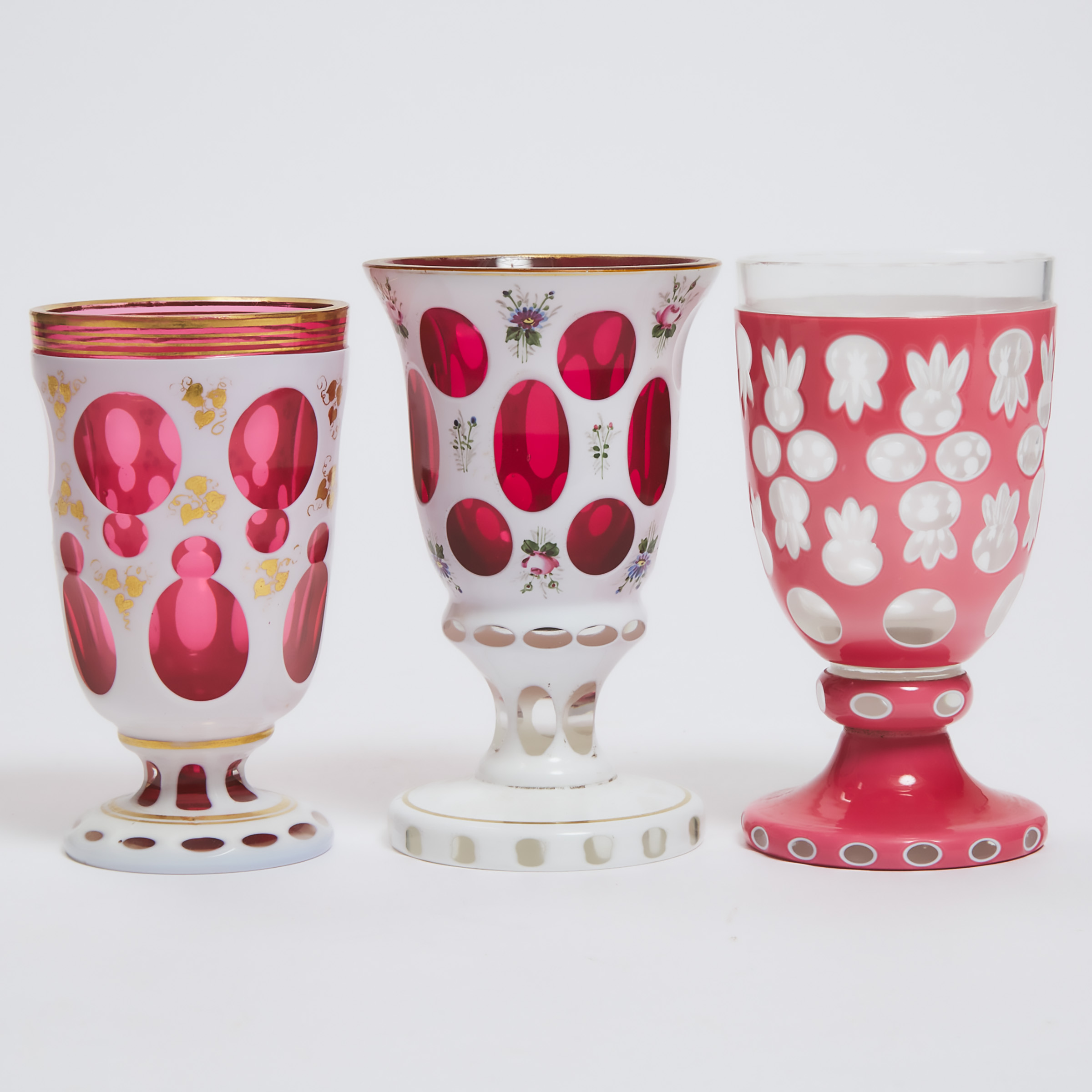 Three Bohemian Overlaid, Cut, Enameled and Gilt Glass Goblets, second half of the 19th century