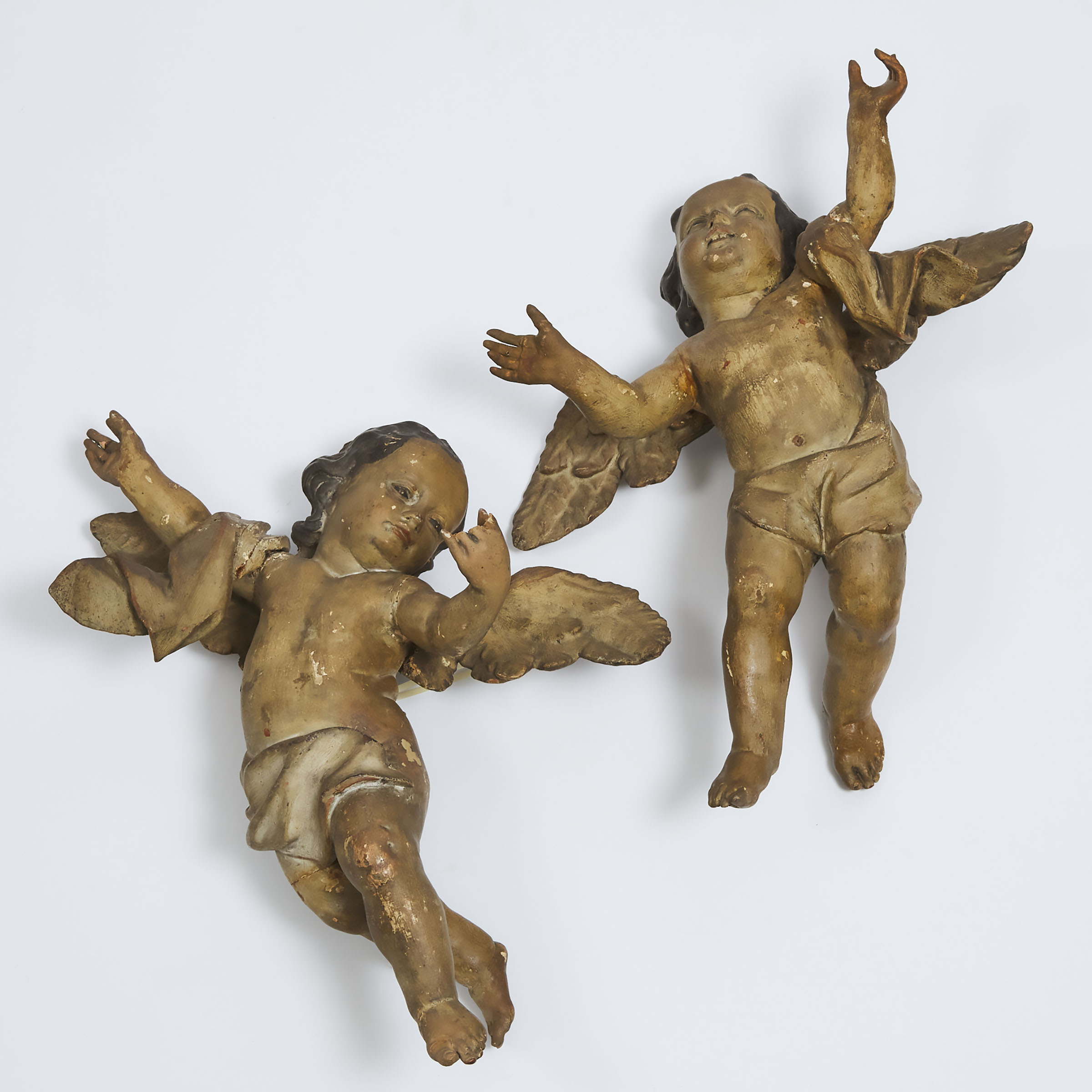 Pair of Large North Italian Baroque Carved and Polychromed Cherubic Figures, 18th/early 19th century