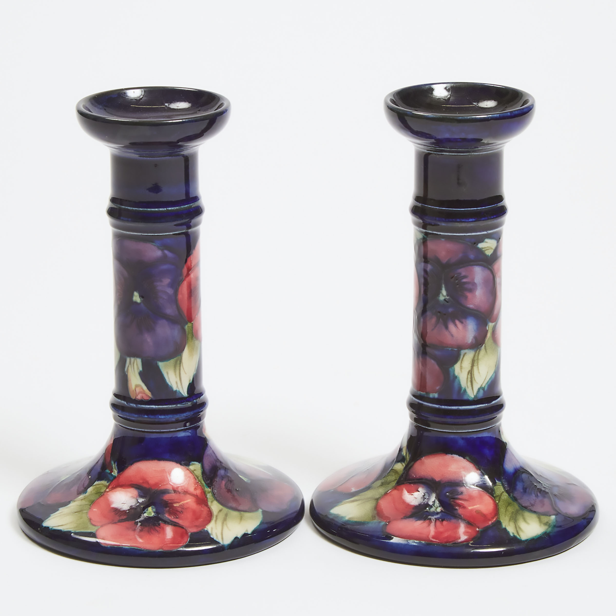 Pair of Moorcroft Pansy Table Candlesticks, c.1925