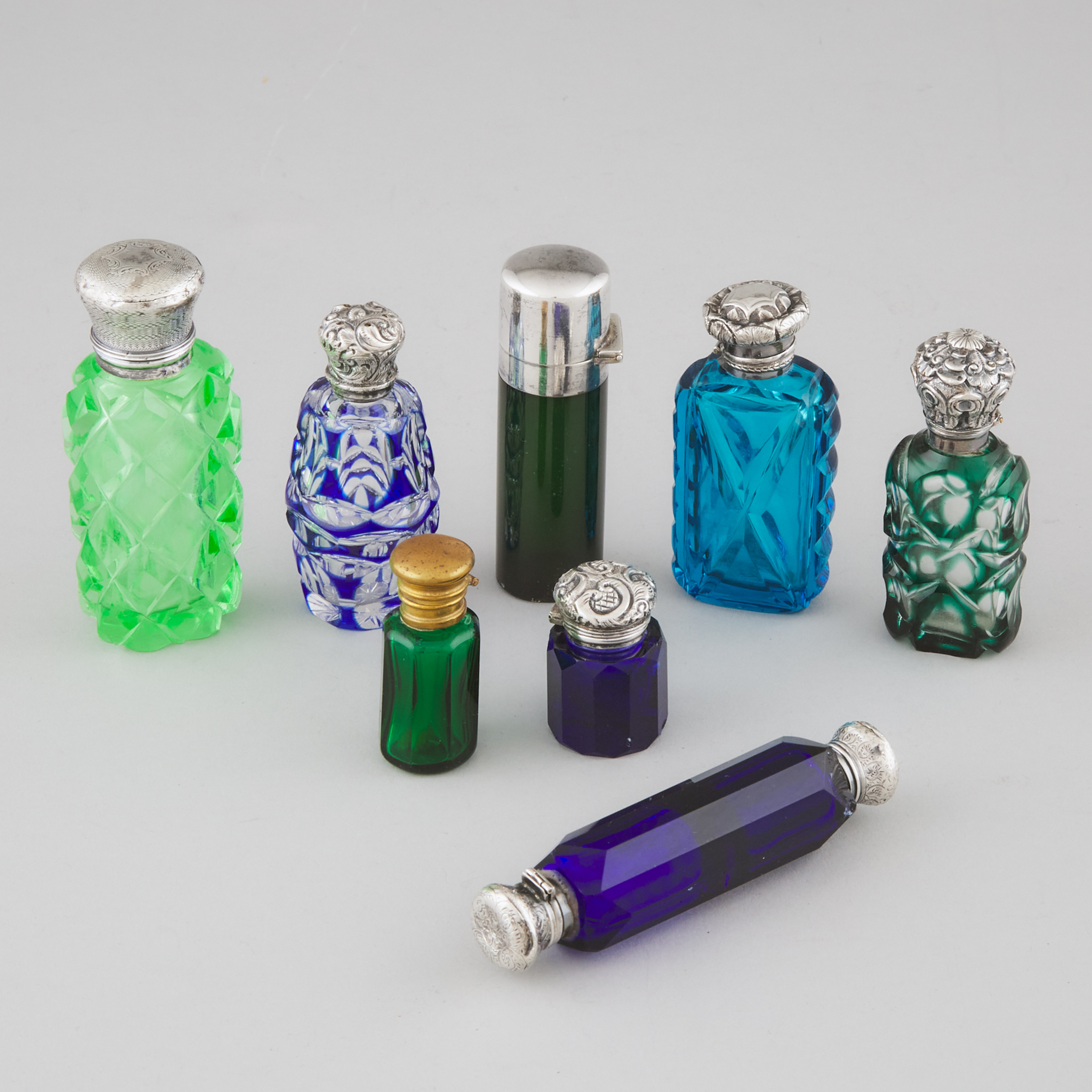 Eight Silver and Metal Mounted Coloured Glass Perfume Bottles and Phials, late 19th/early 20th century