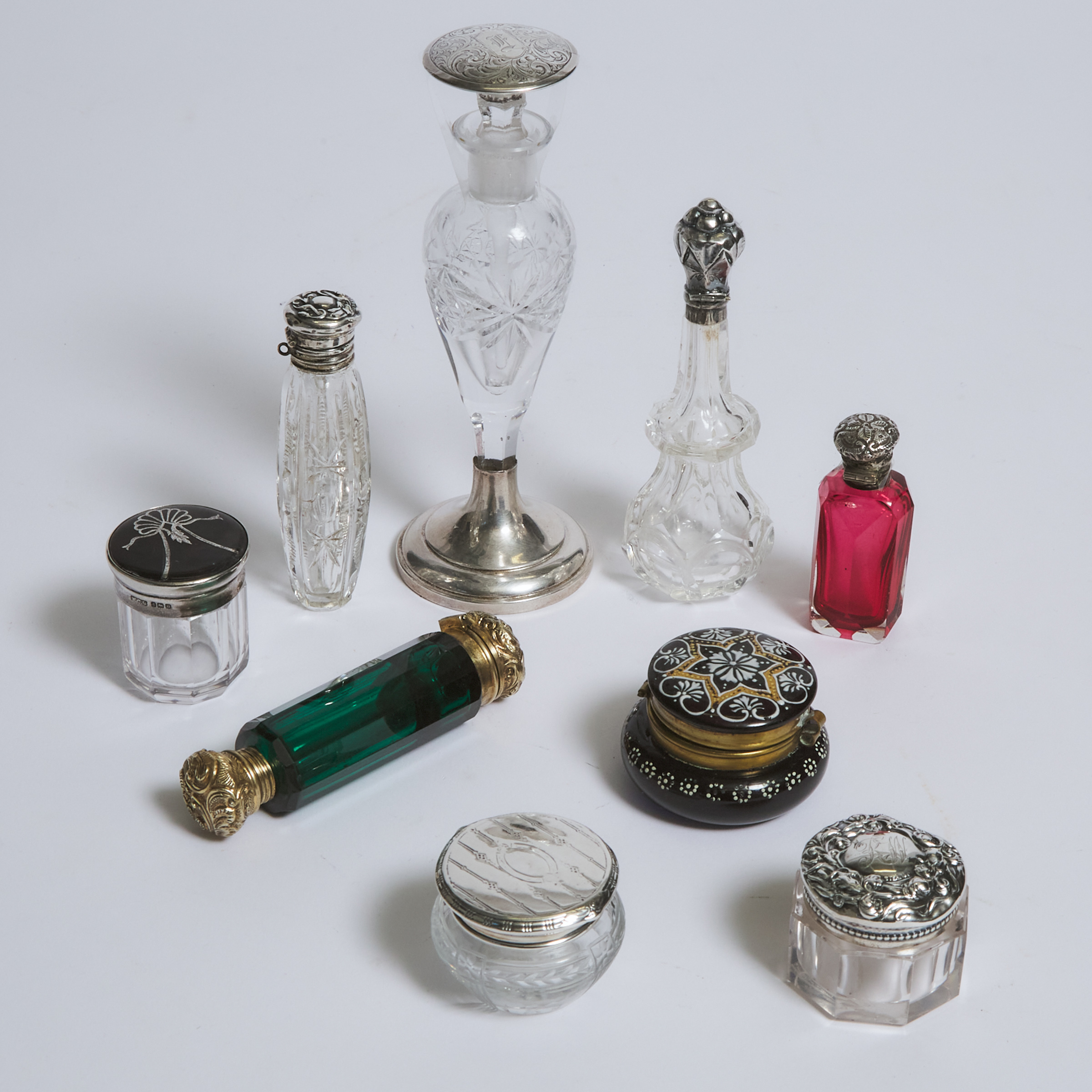 Group of Five Silver and Metal Mounted Glass Perfume Bottles and Four Small Jars, late 19th/early 20th century