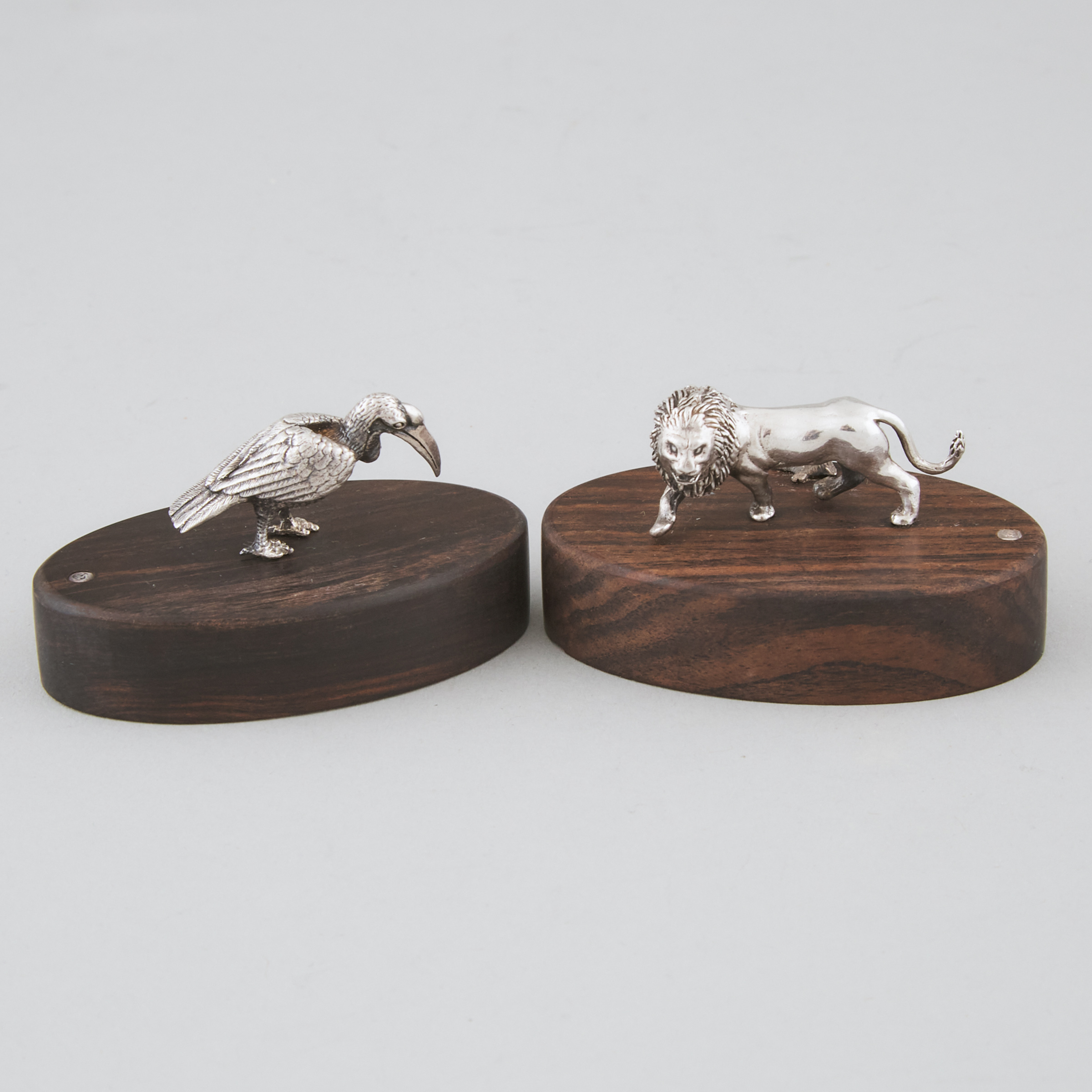 Pair of Zimbabwean Silver 'Lion' or 'Hornbill' Place Card or Menu Holders, Patrick Mavros, Harare, late 20th century