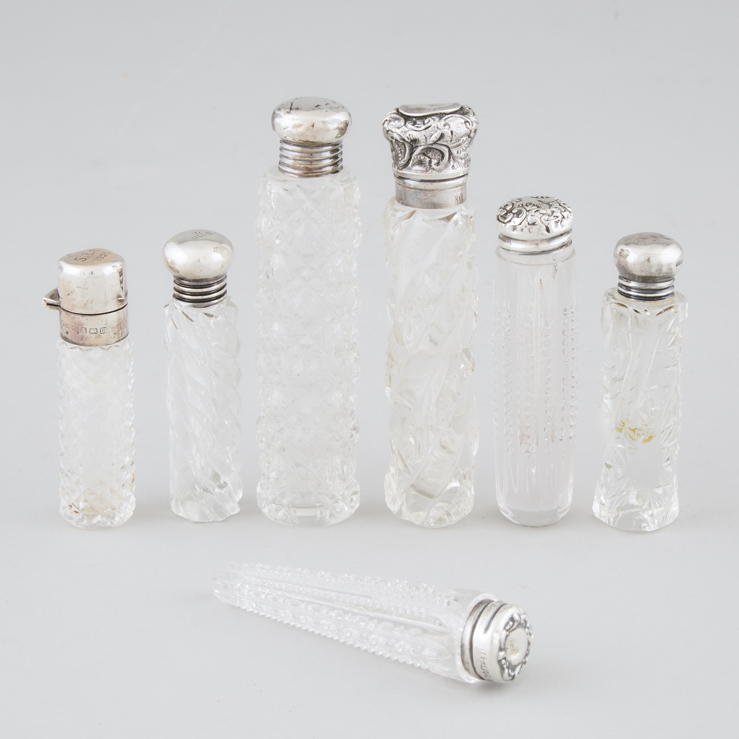 Seven English and North American Silver Mounted Cut Glass Perfume Bottles and Phials, late 19th/early 20th century