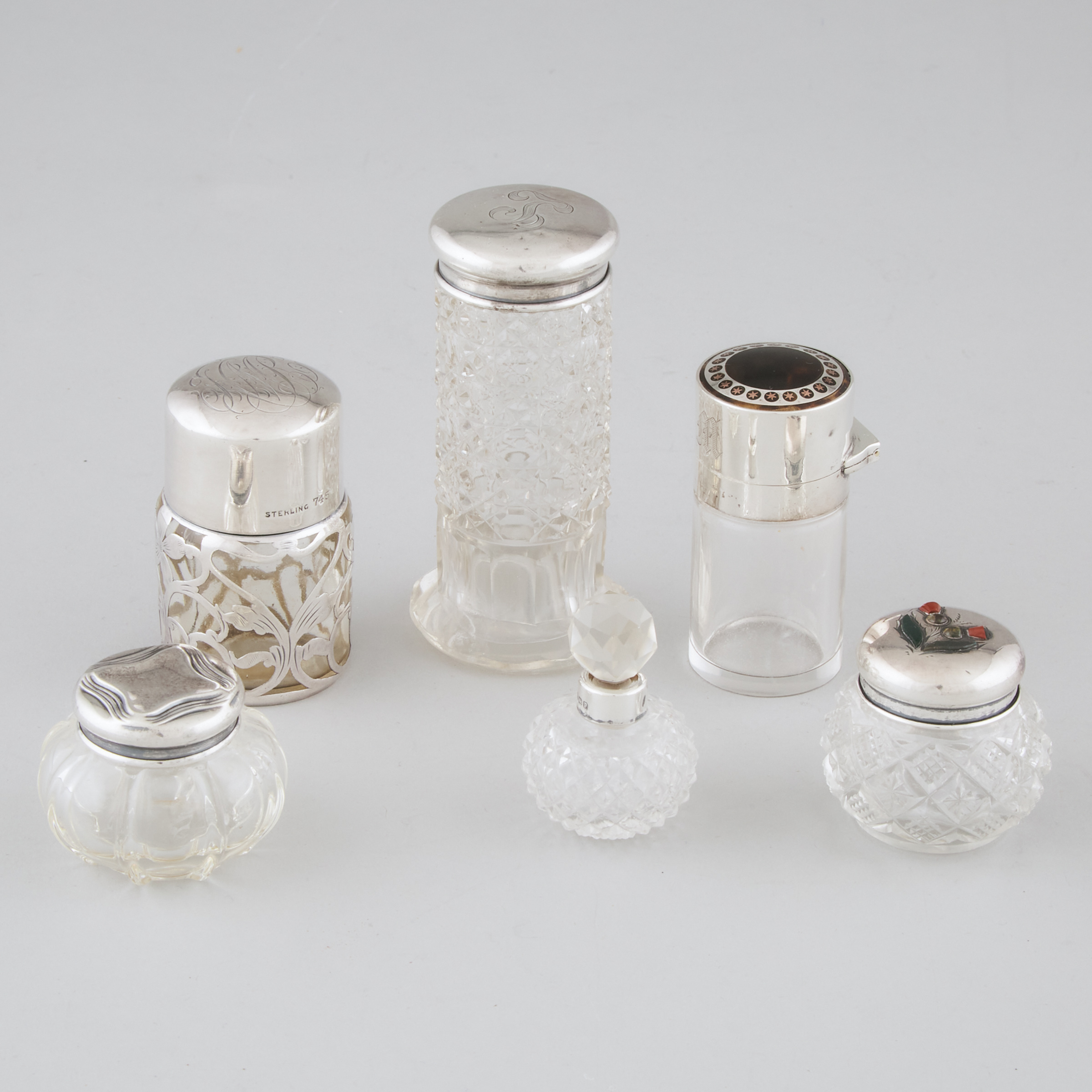 Six English and North American Silver Mounted Glass Perfume Bottles and Jars, late 19th/early 20th century