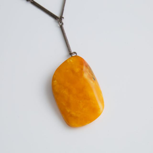 Carved Amber Pendant
