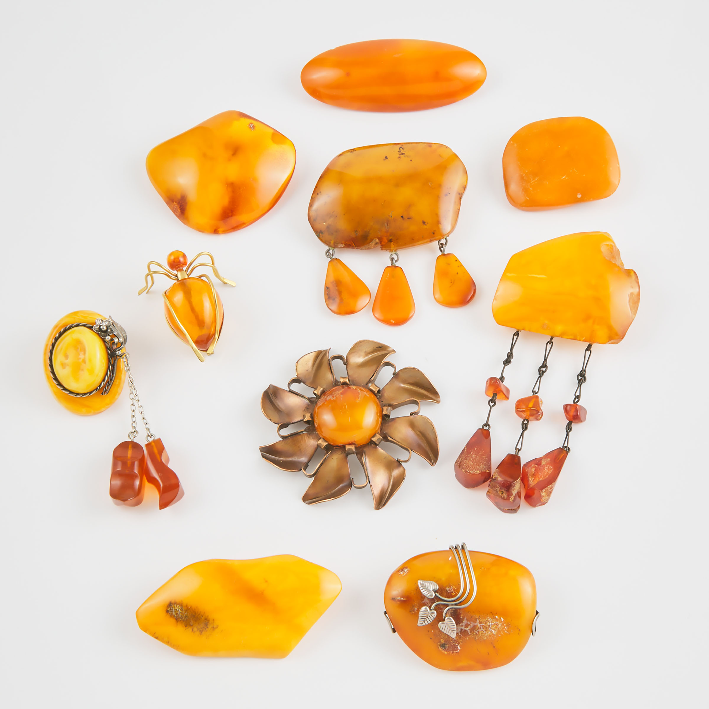 10 Various Amber And Metal Brooches