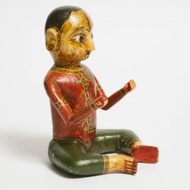 An Indian Polychrome Wood Figure of a Child, Gujarat, 19th Century