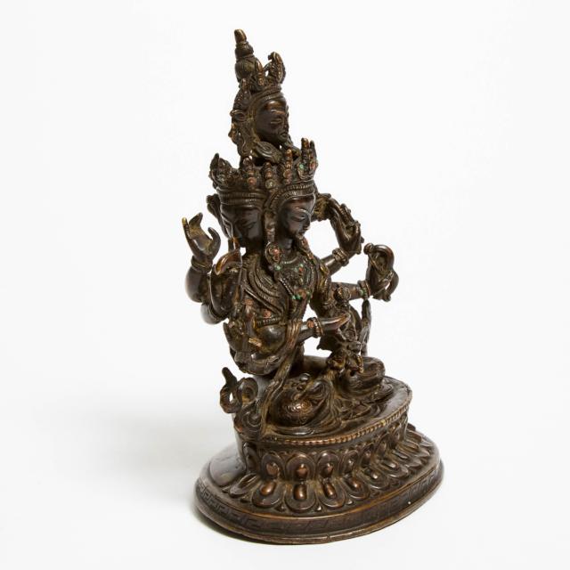 An Inlaid Bronze Seated Figure of Pratisara, 19th/20th Century