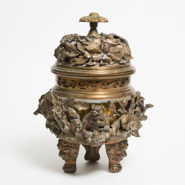 A Chinese 'Lions and Flowers' Tripod Incense Burner and Cover, Late 19th/Early 20th Century