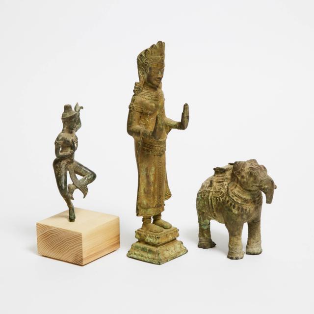 A Group of Three Khmer Bronze Goddesses and Elephant, 12th Century or Later
