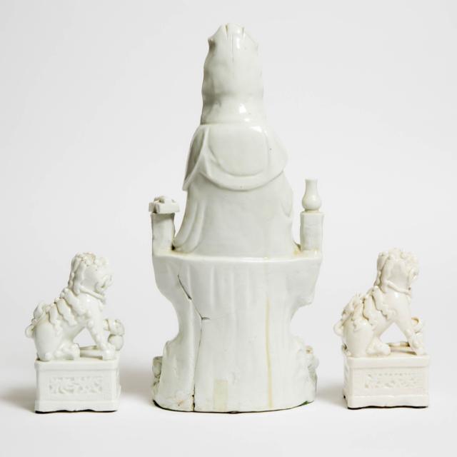 A Pair of Blanc de Chine Lions, Together With a Guanyin Group, Kangxi Period (1662-1722)