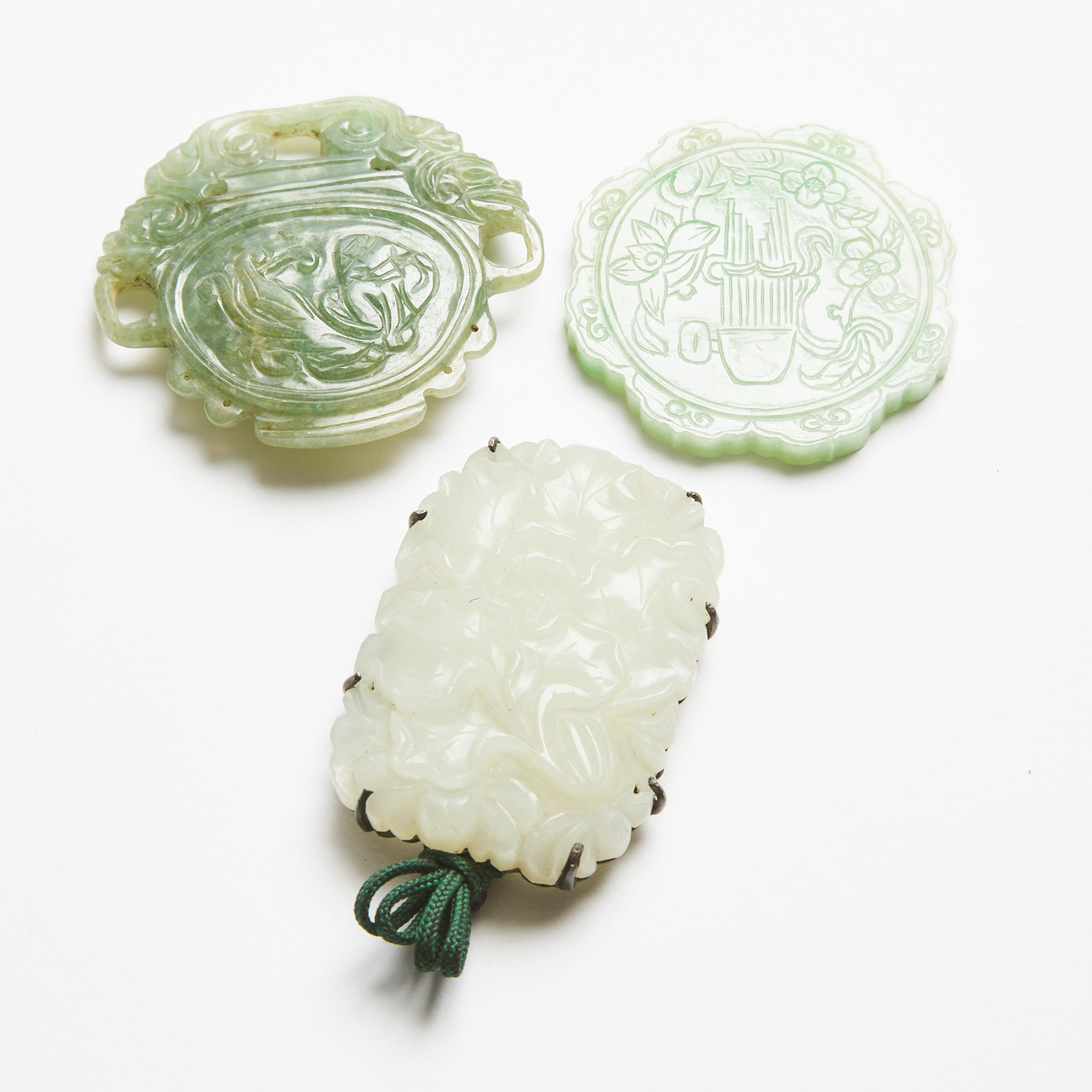 A Group of Three Jade and Jadeite Pendants, 19th/20th Century