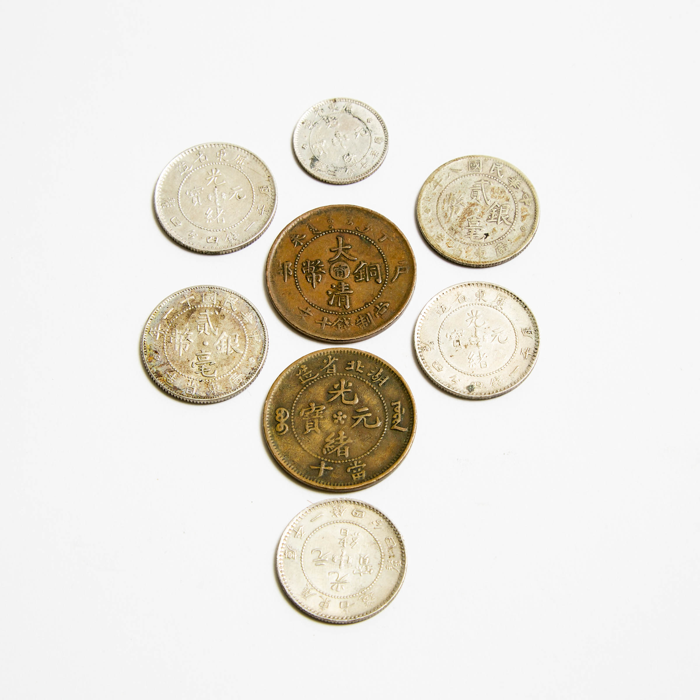 A Group of Eight Assorted Chinese Cash Coins