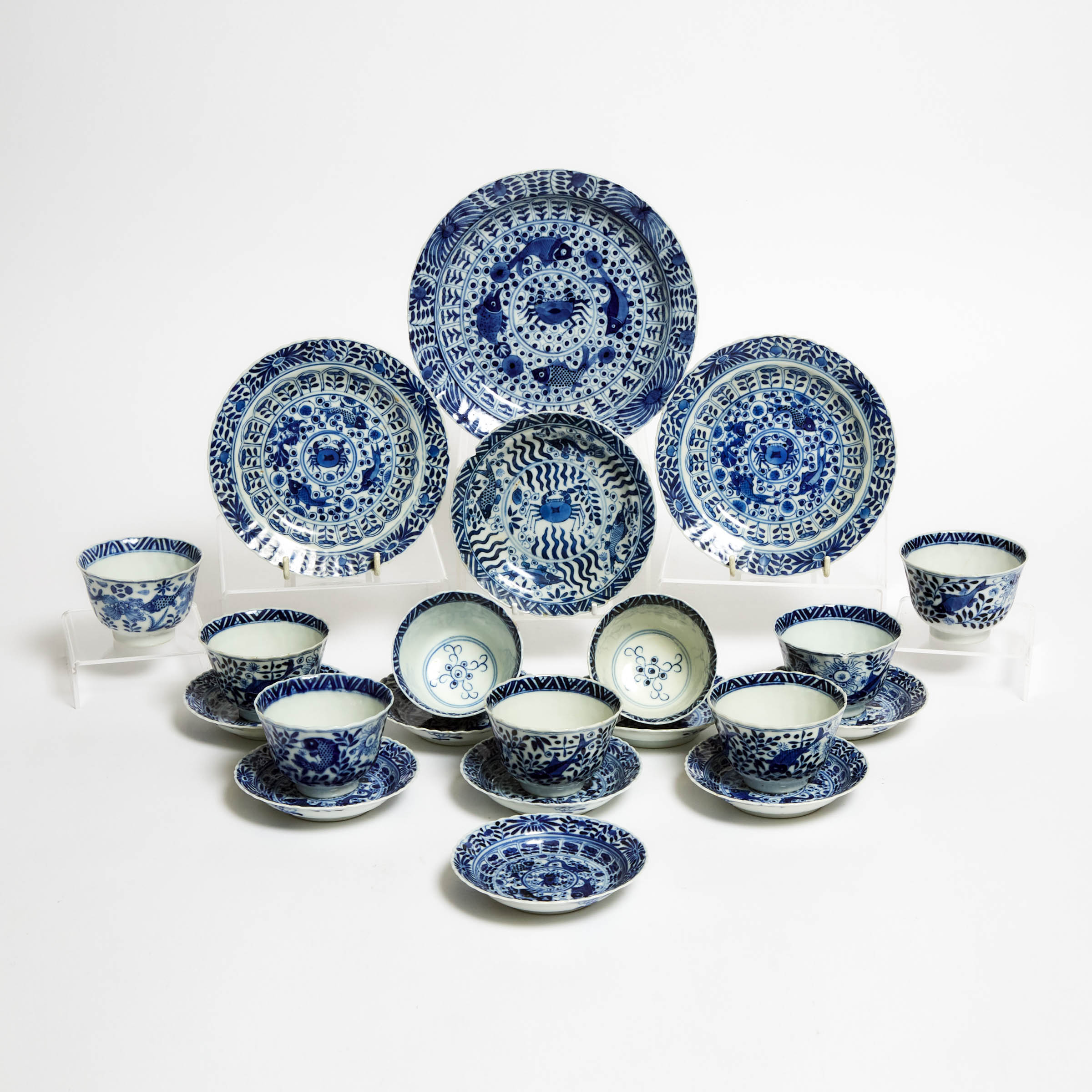 A Group of Twenty-One Blue and White 'Crabs and Fish' Cups, Saucers, and Dishes, Kangxi Period (1662-1722)