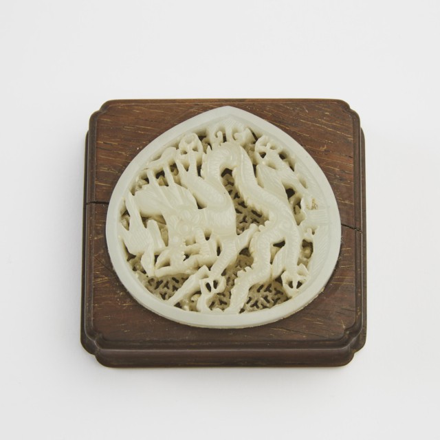 A White Jade Reticulated 'Dragon' Plaque, Ming Dynasty (1368-1644)