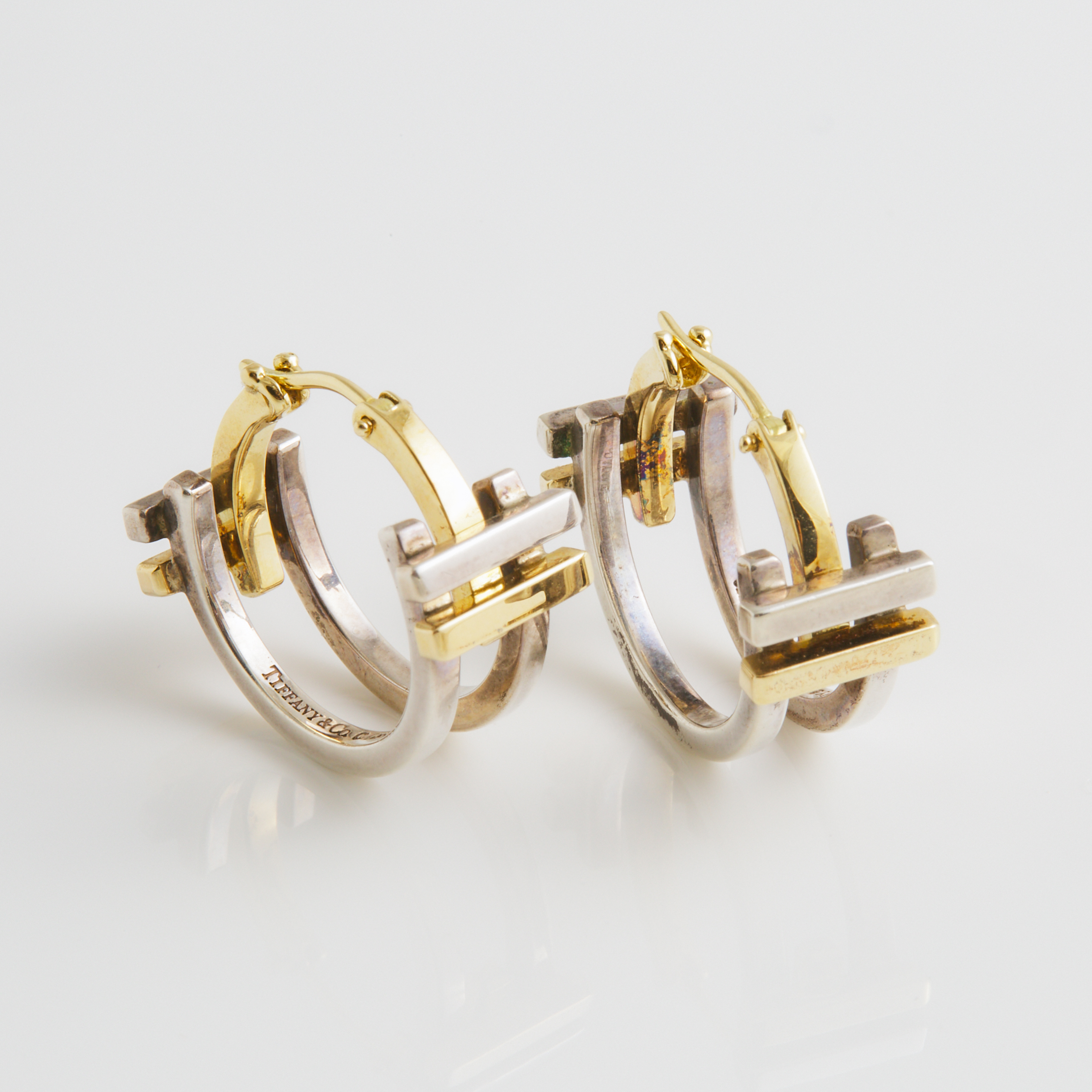 Pair Of Tiffany & Co. Frank Gehry "Axis" 18k Yellow Gold And Sterling Silver Hoop Earrings
