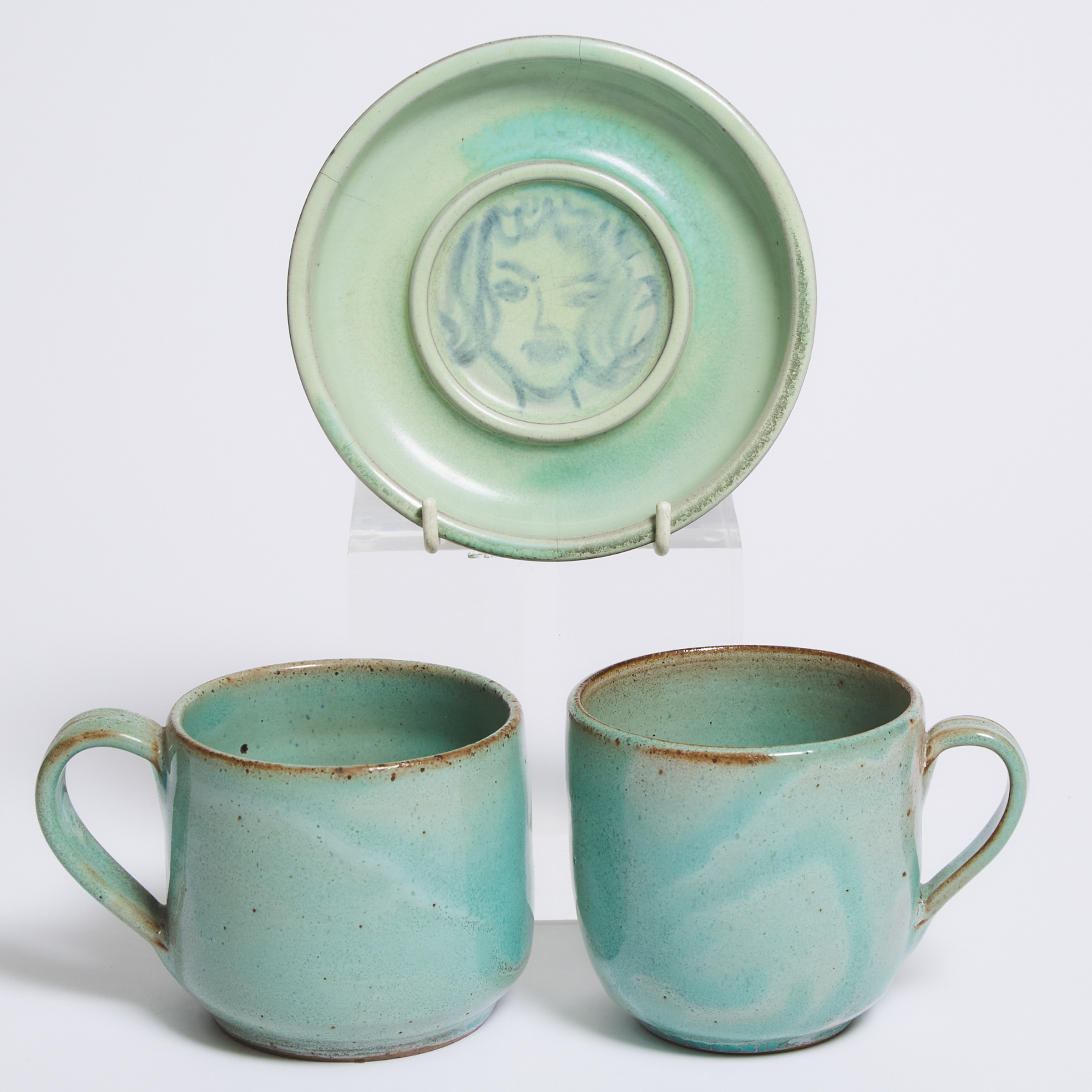 Two Deichmann Mottled Green Glazed Stoneware Mugs and a Small Portrait Dish, mid-20th century