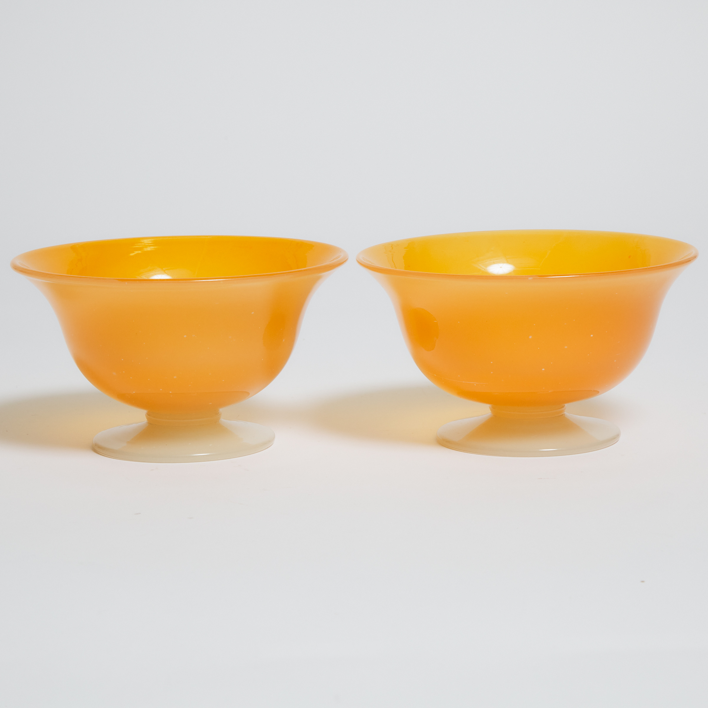 Pair of Orange Glass Bowls, probably Steuben, early 20th century 