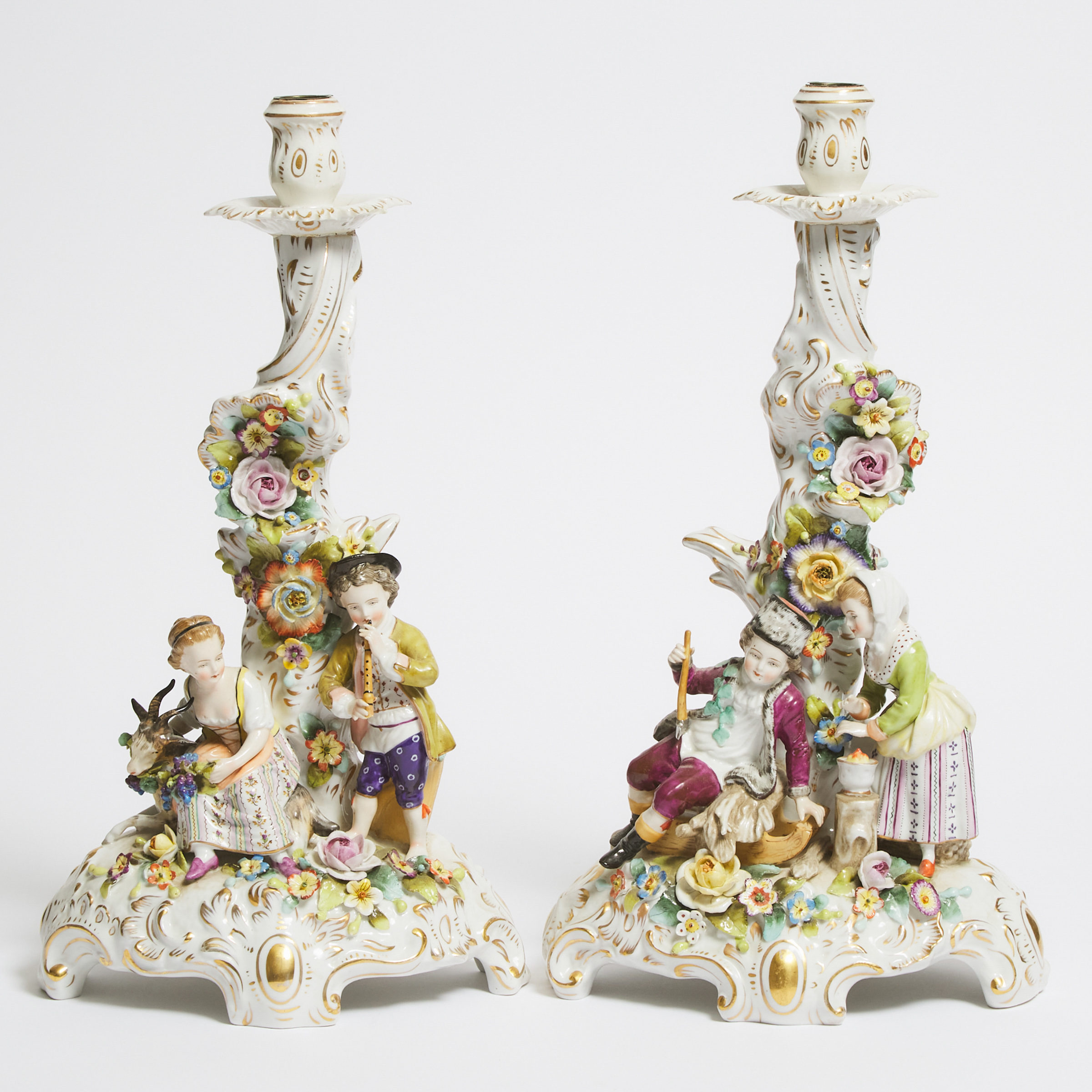 Pair of German Porcelain Candlestick Figure Groups of 'Winter' and 'Summer', late 19th/early 20th century