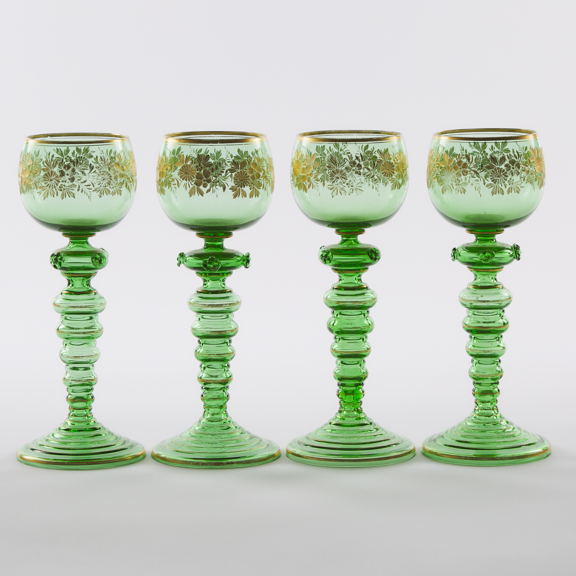 Four Continental Engraved and Gilt Green Glass Roemers, c.1900