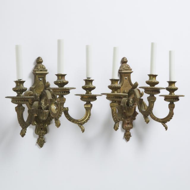 Pair of French 18th Century Style Three Light Gilt Bronze Wall Sconces, early 20th century