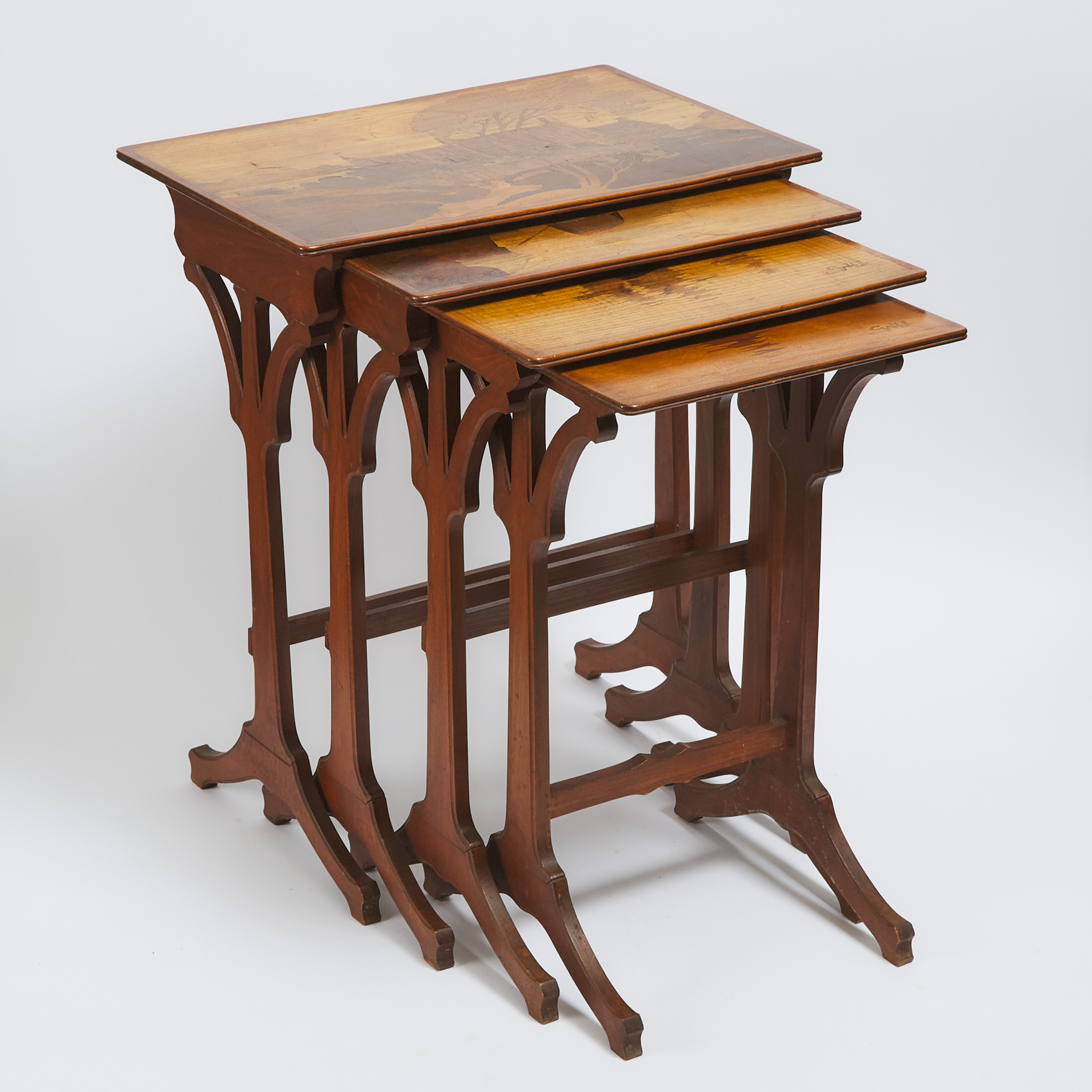Set of Four Gallé Mixed Wood Inlaid Nesting Tables, early 20th century