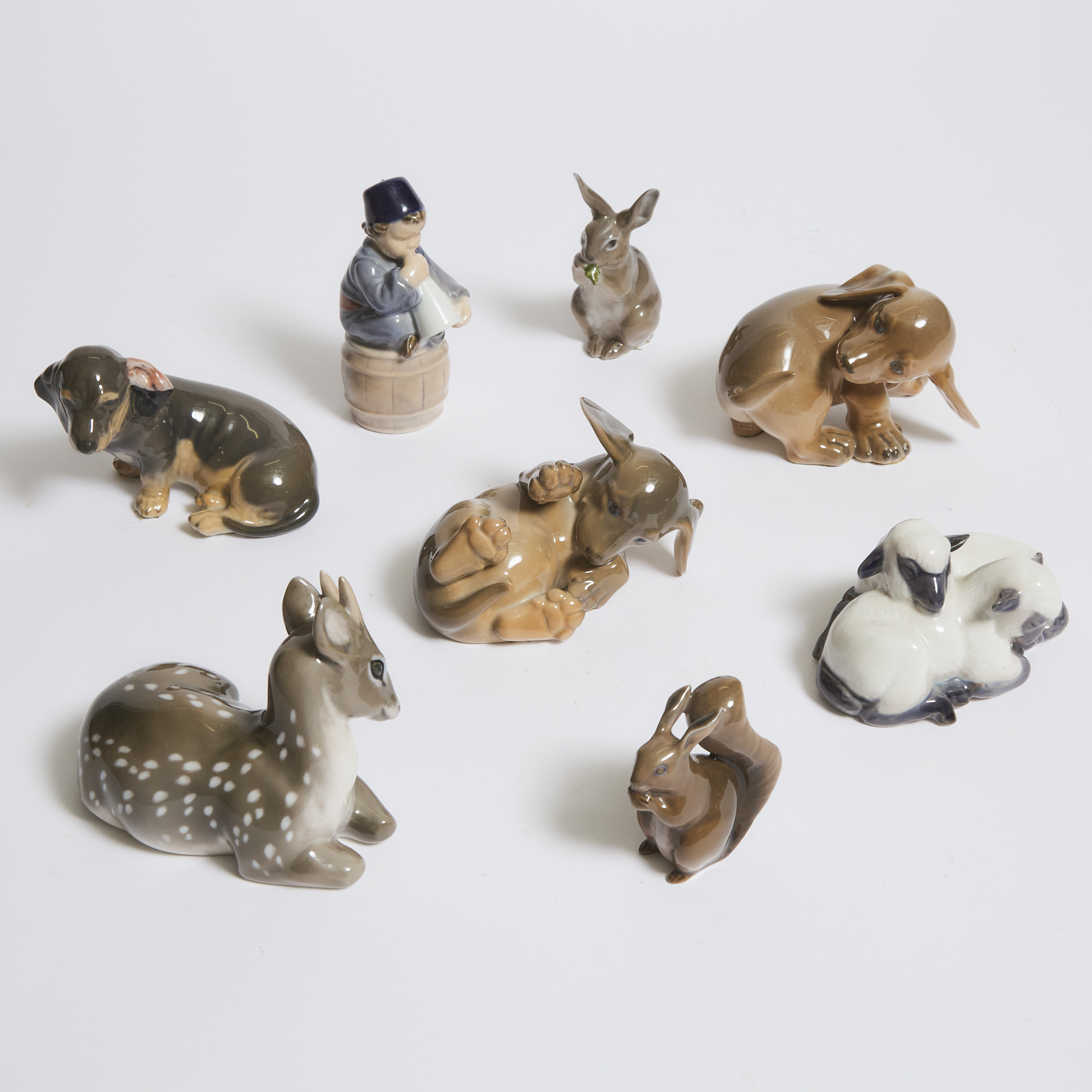 Royal Copenhagen Seated Boy and Seven Various Animal Models and Groups, 20th century