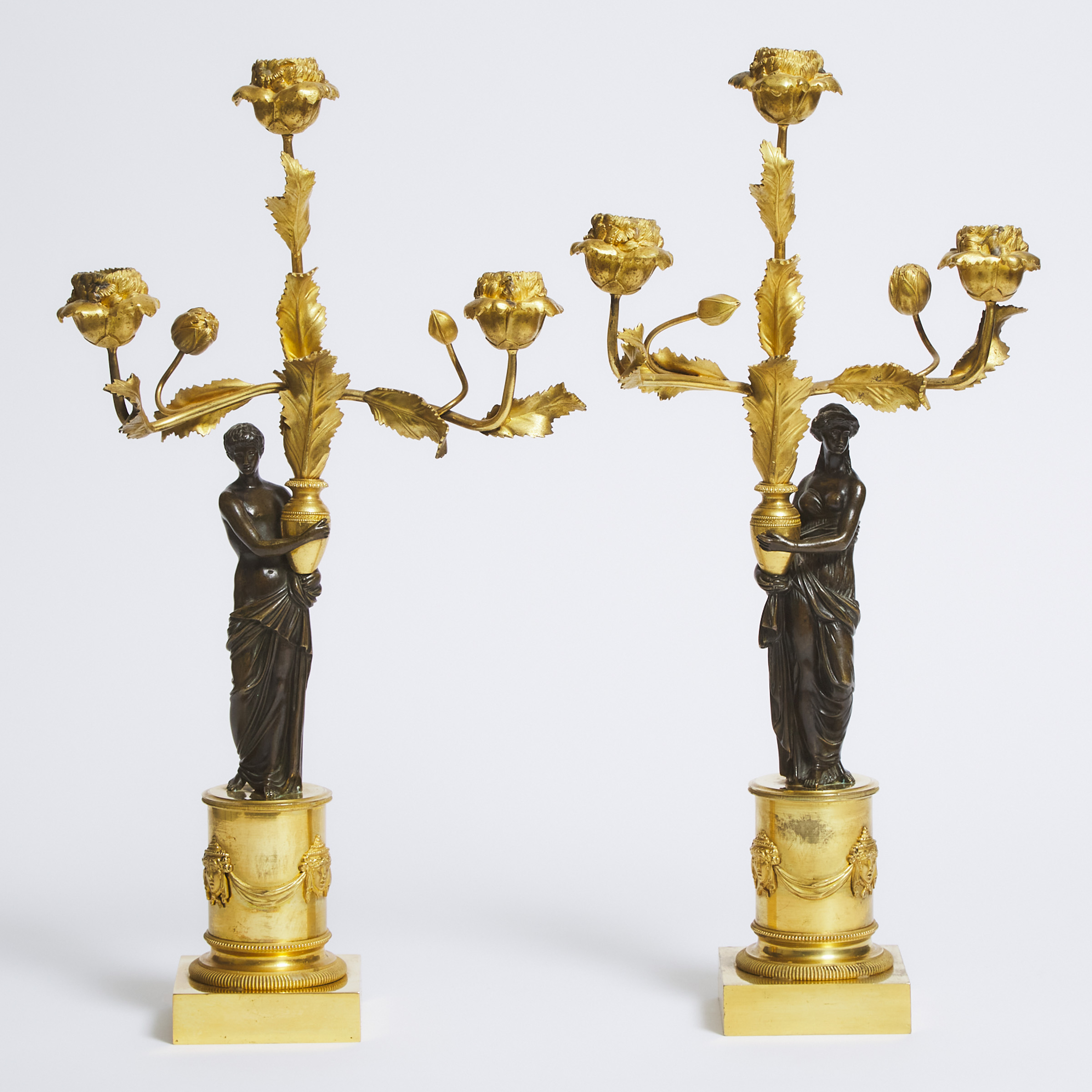 Pair of French Restauration Gilt and Patinated Bronze Three Light Candelabra, early 19th century