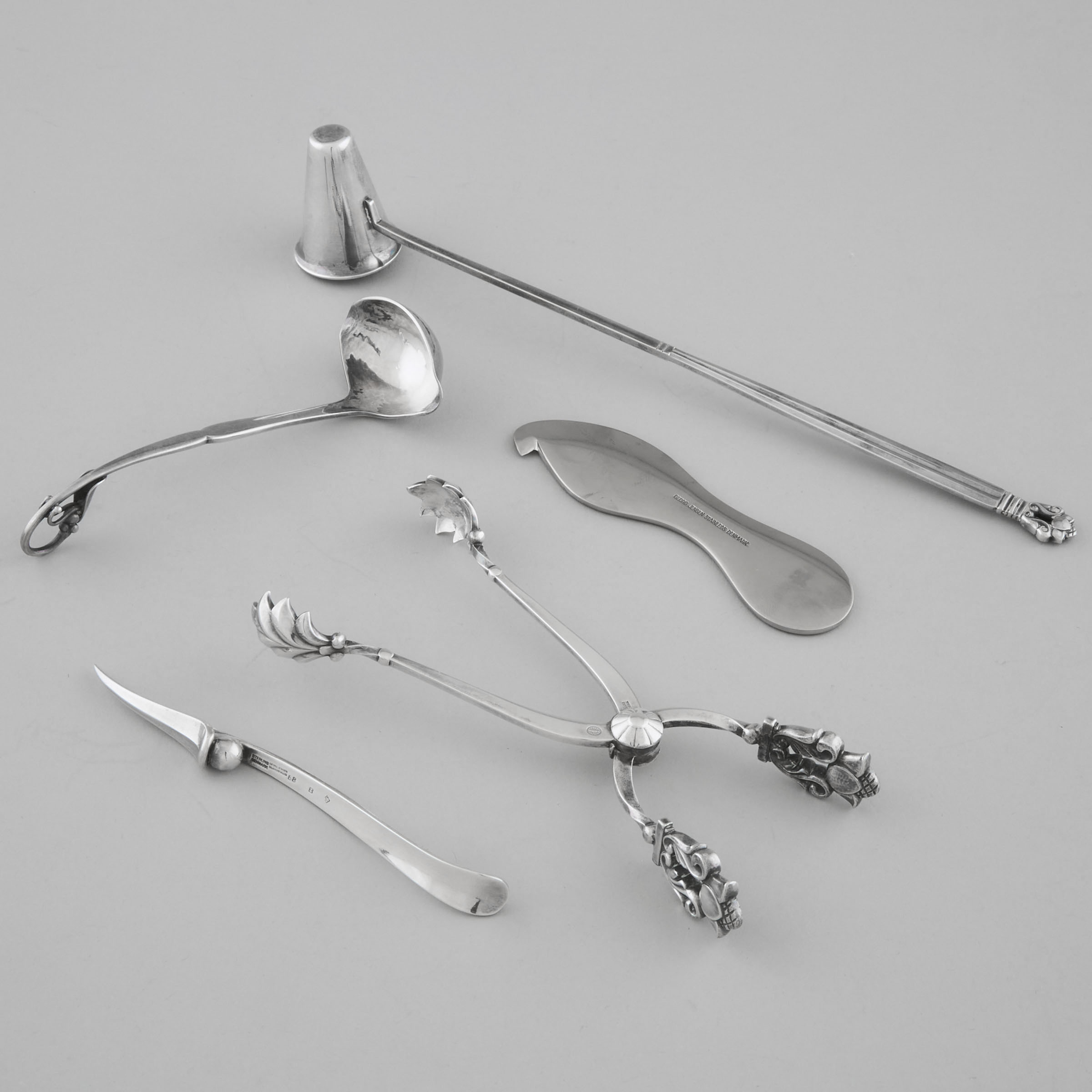 Danish Silver 'Acorn' Pattern Ice Tongs and a Candle Snuffer, #372, Johan Rohde, a Nut Pick, #68B, and Sauce Ladle, #21, Georg Jensen, Copenhagen, 20th century