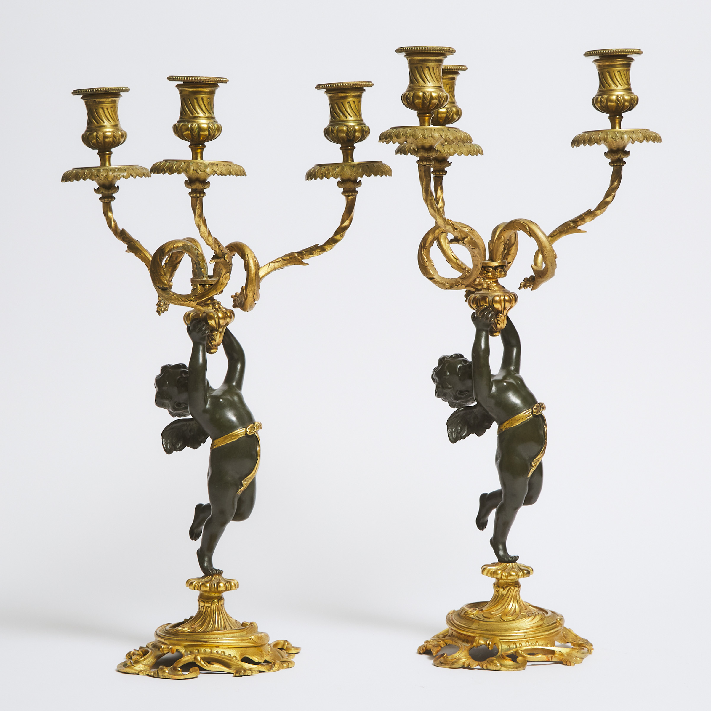 Pair Napoleon III Patinated and Gilt Bronze Figural Three Light Candelabra, early 20th century