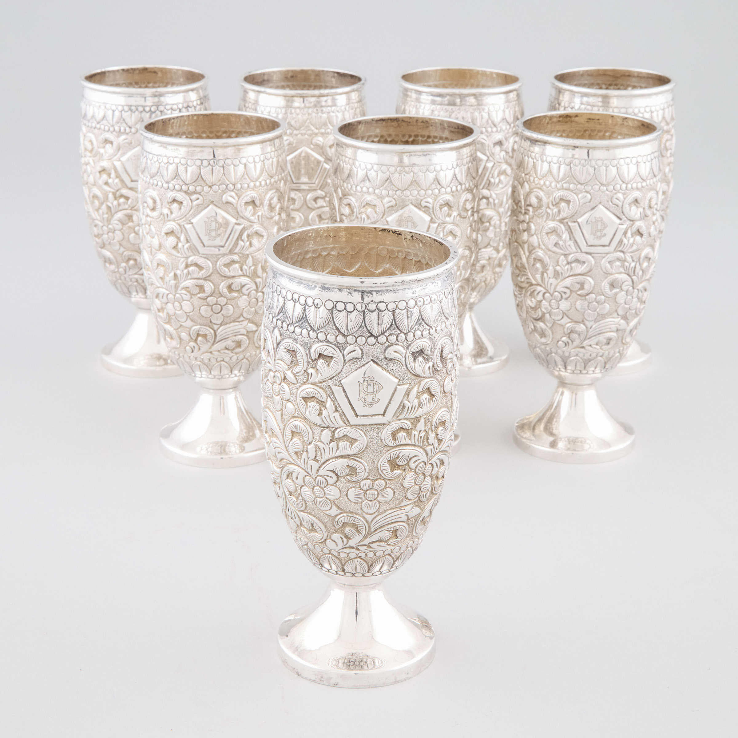Eight Indian Repoussé and Engraved Silver Goblets, 20th century