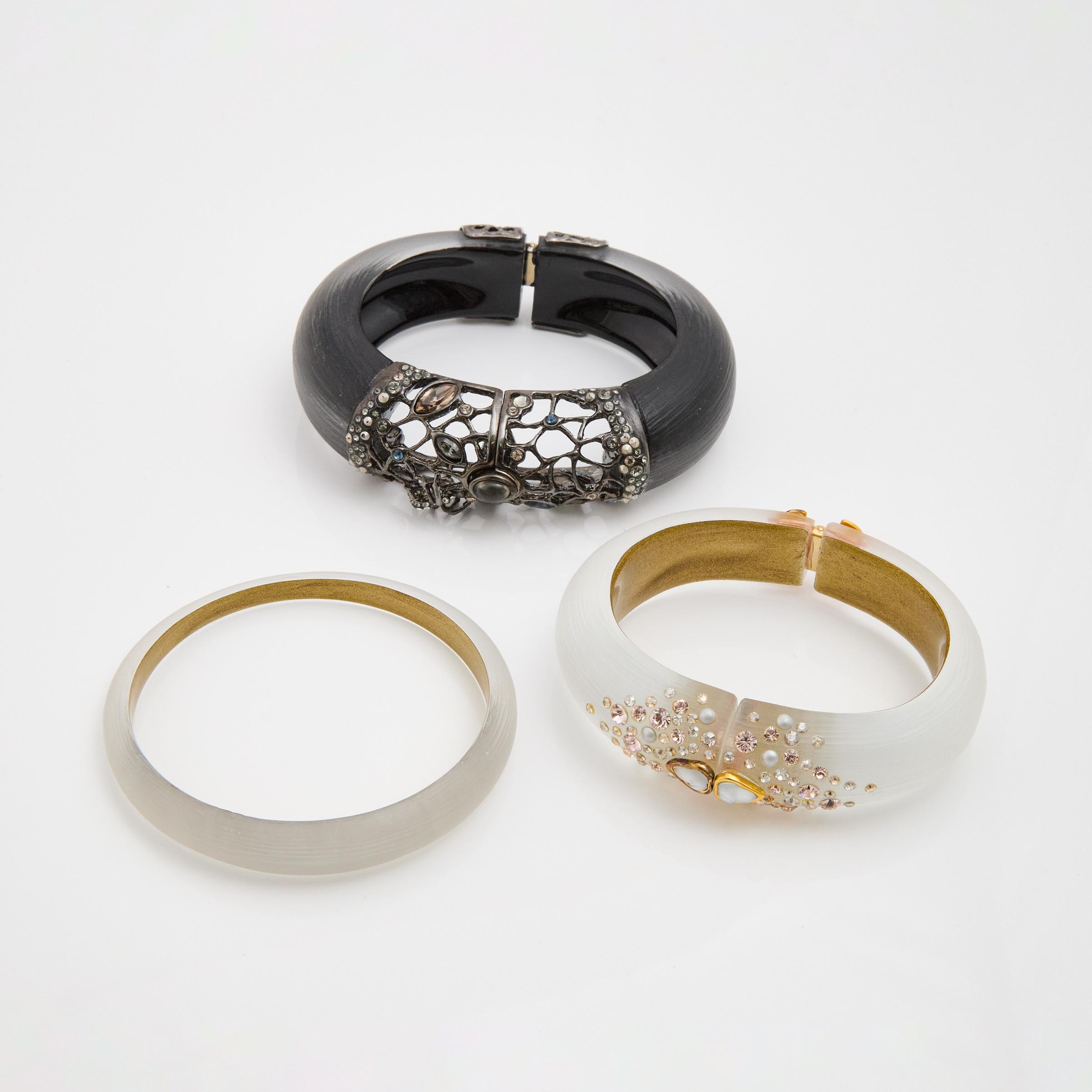 Three Alexis Bittar Carved Lucite, Gold-Tone & Black-Tone Metal Bangles