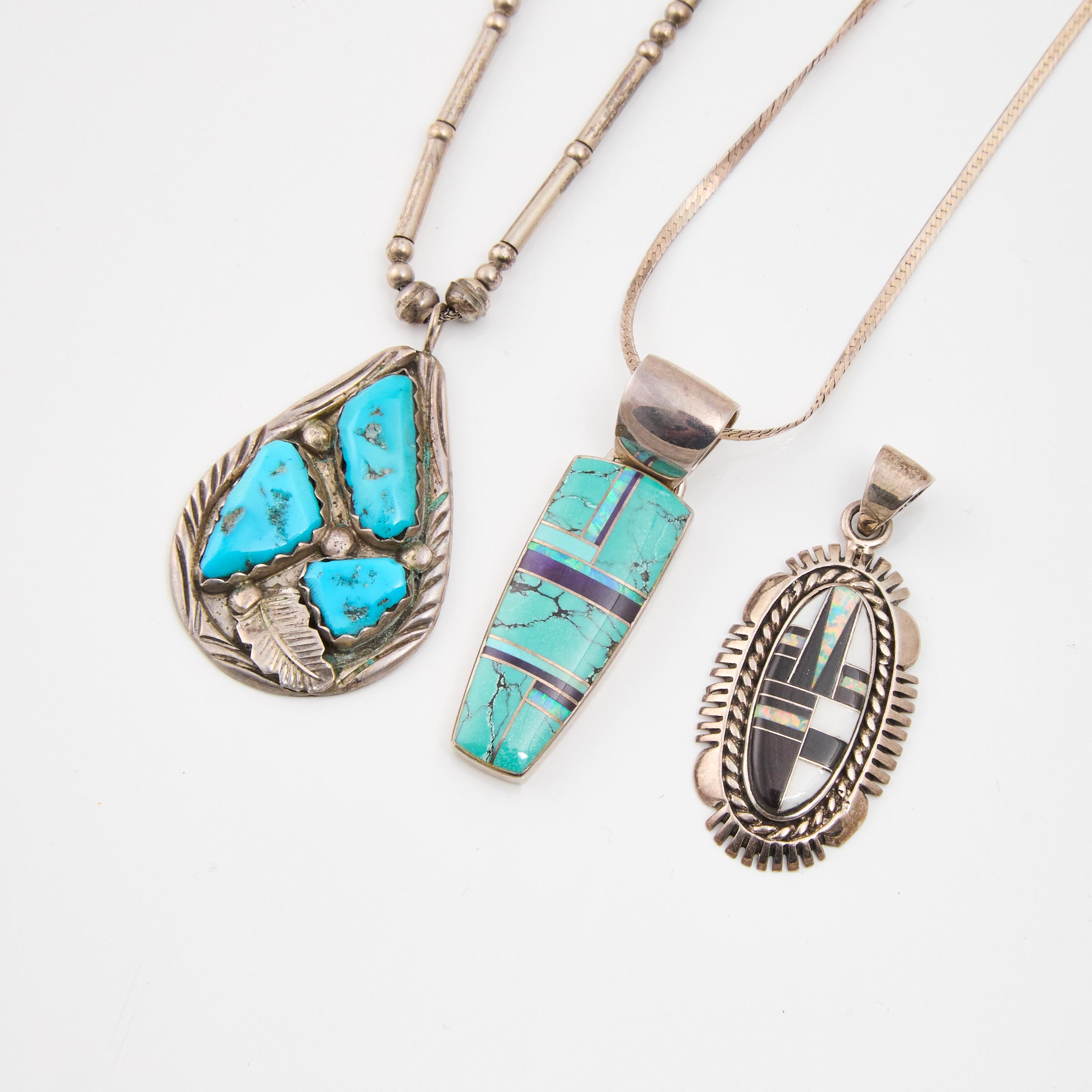 Three Navajo Silver Pendants