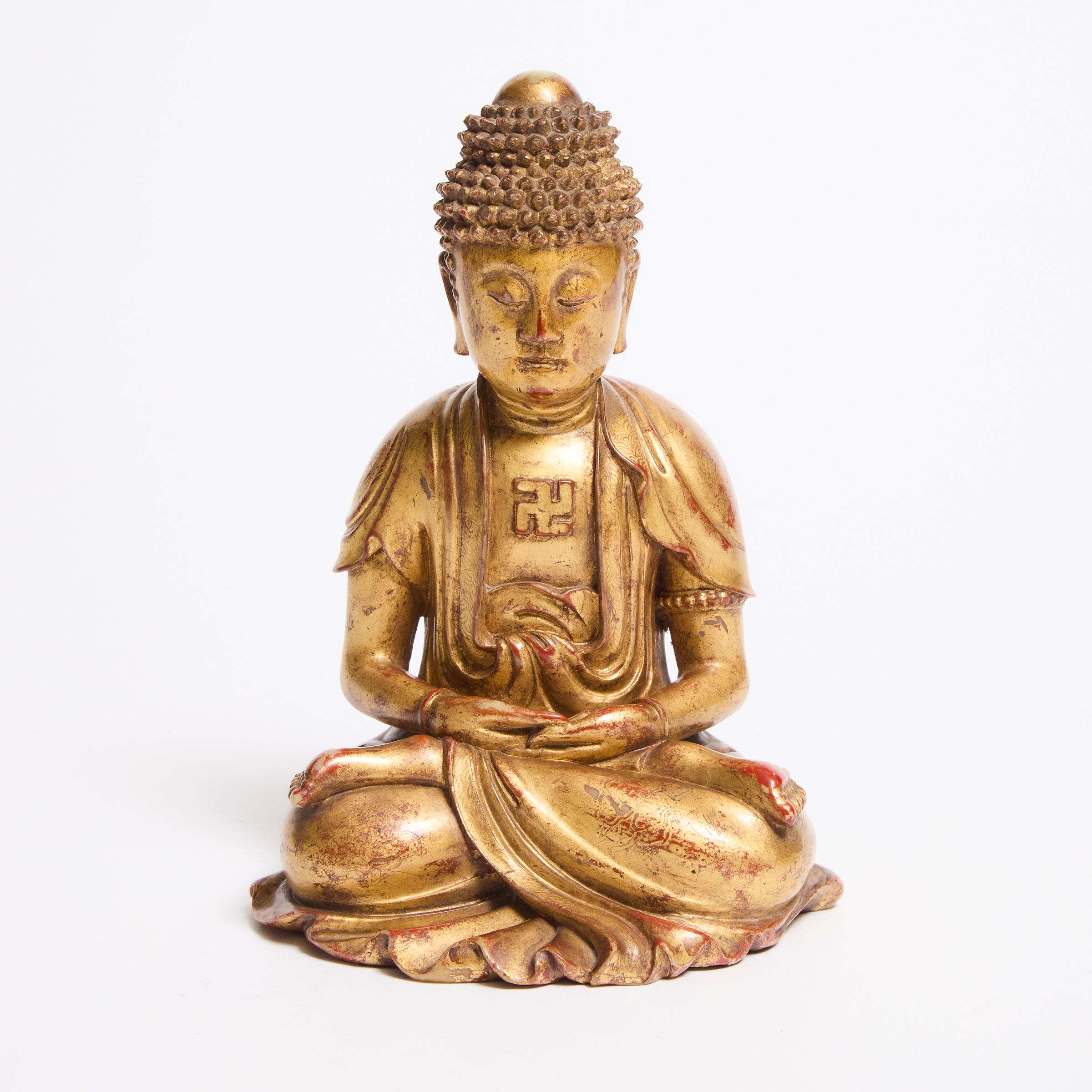 A Rare Gilt-Lacquered Soapstone Figure of Buddha, Ming Dynasty (1368-1644)
