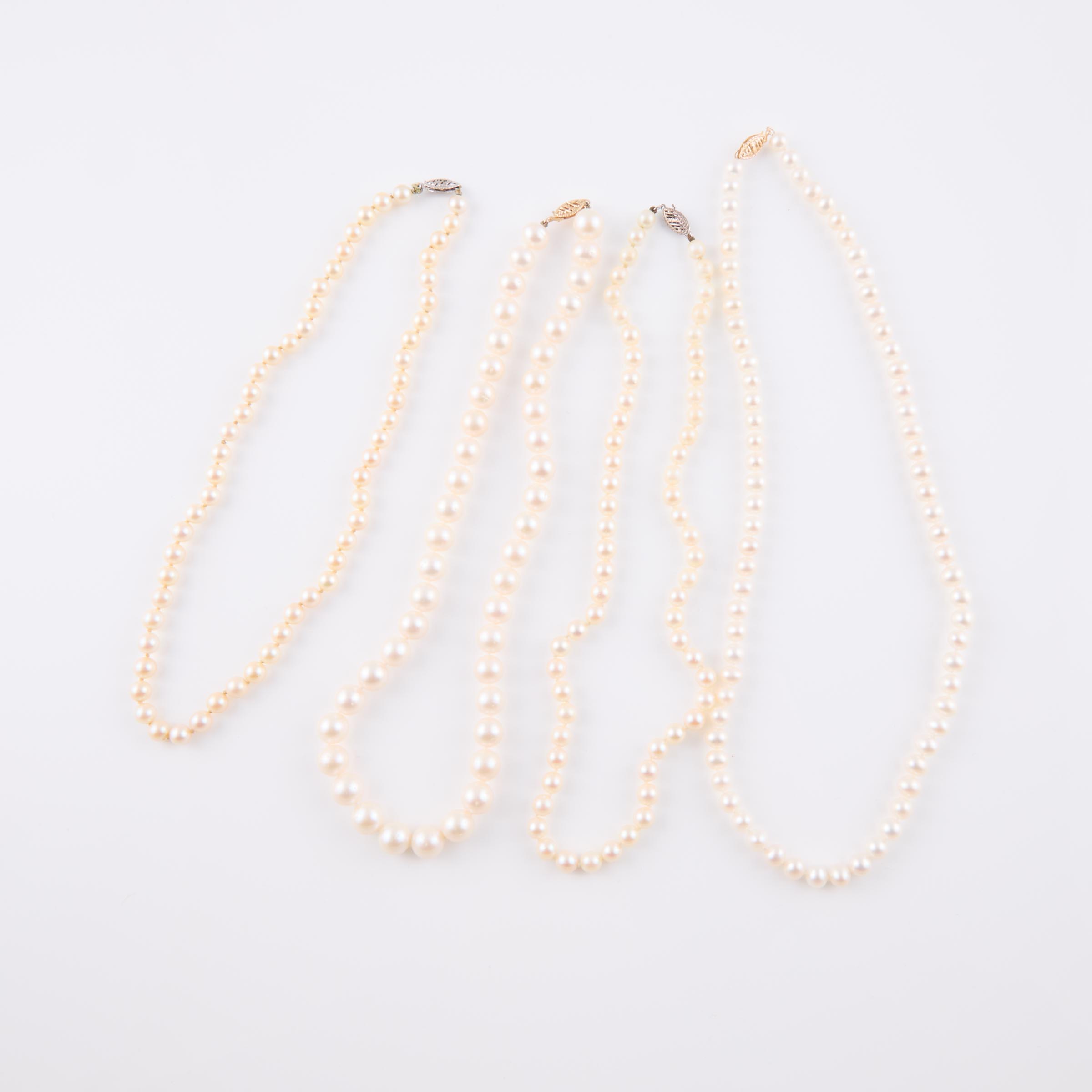 Four Single Strand Freshwater And Cultured Pearl Necklaces