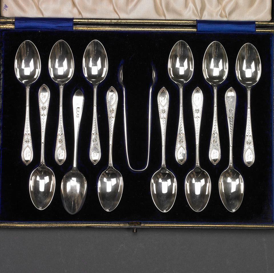 Twelve English Engraved Silver Coffee Spoons and Sugar Tongs, George Jackson & David Landsborough, London, 1911