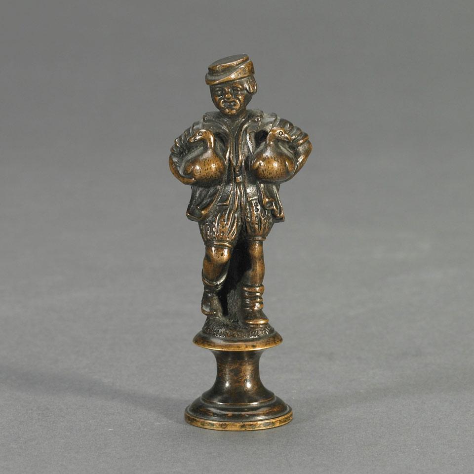 Patinated Bronze Figural Desk Seal Modelled as a Bavarian Carrying Two Geese, late 19th century