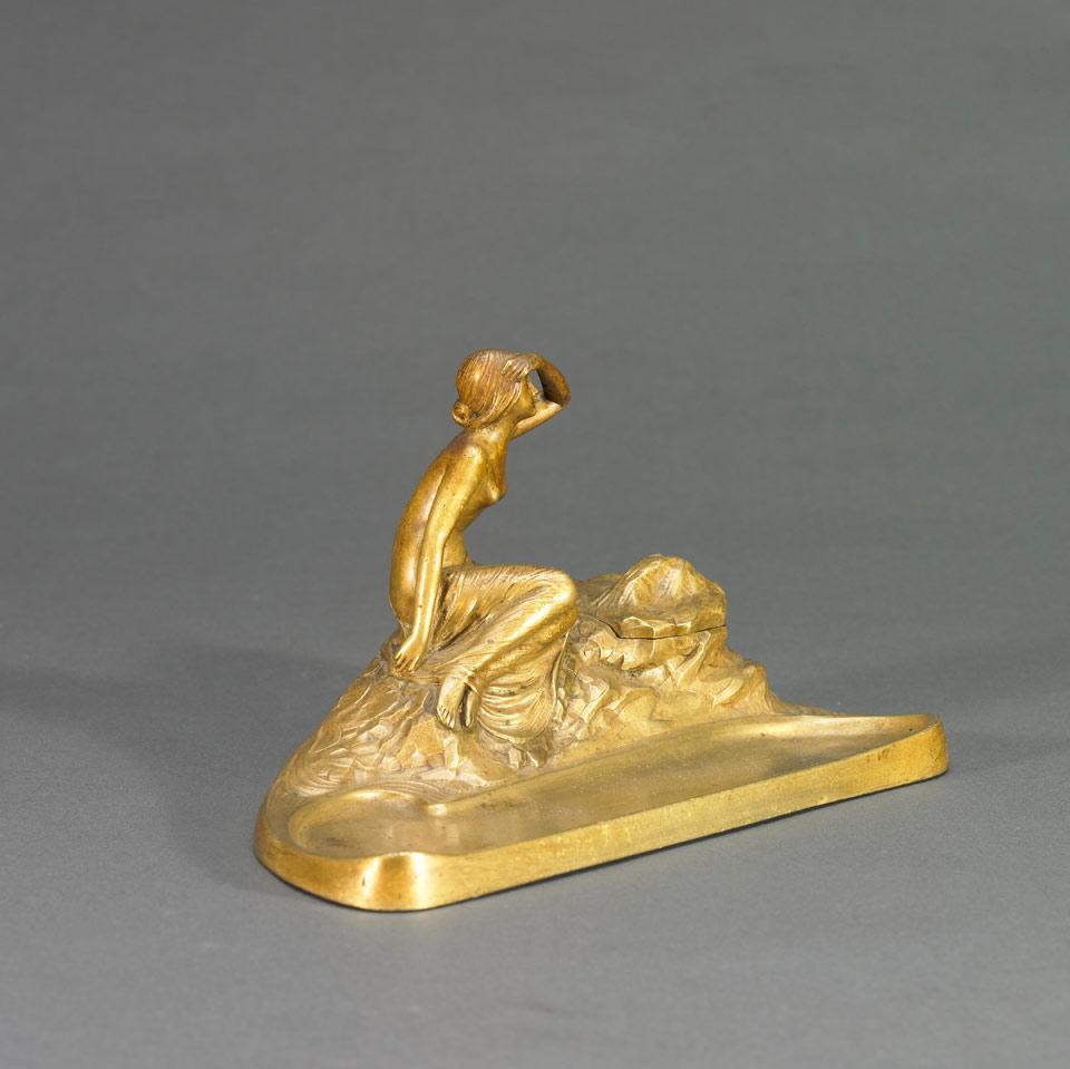 French Gilt Bronze Inkwell with Pen Tray, Modelled as a Young Maiden Perched on Rocks Scanning the Horizon, c.1900