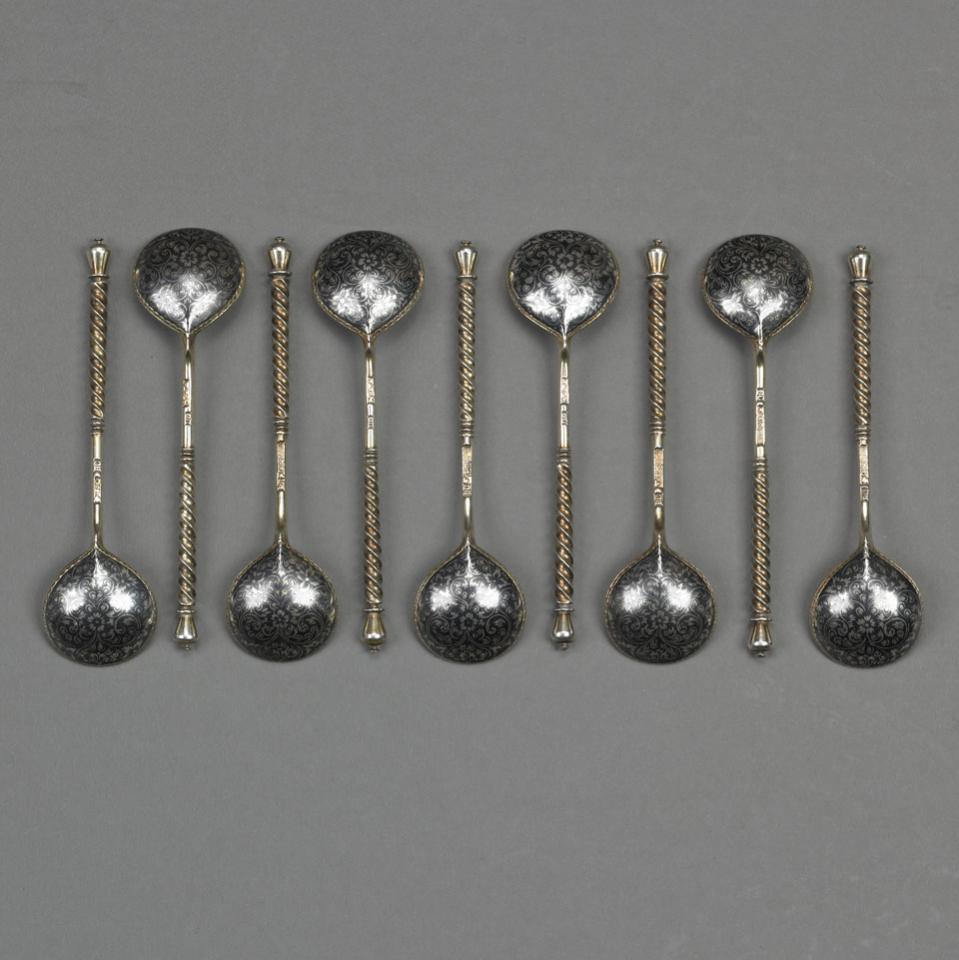 Eight Russian Nielloed Silver-Gilt Spoons, probably Vasily Semenov, Moscow, 1883