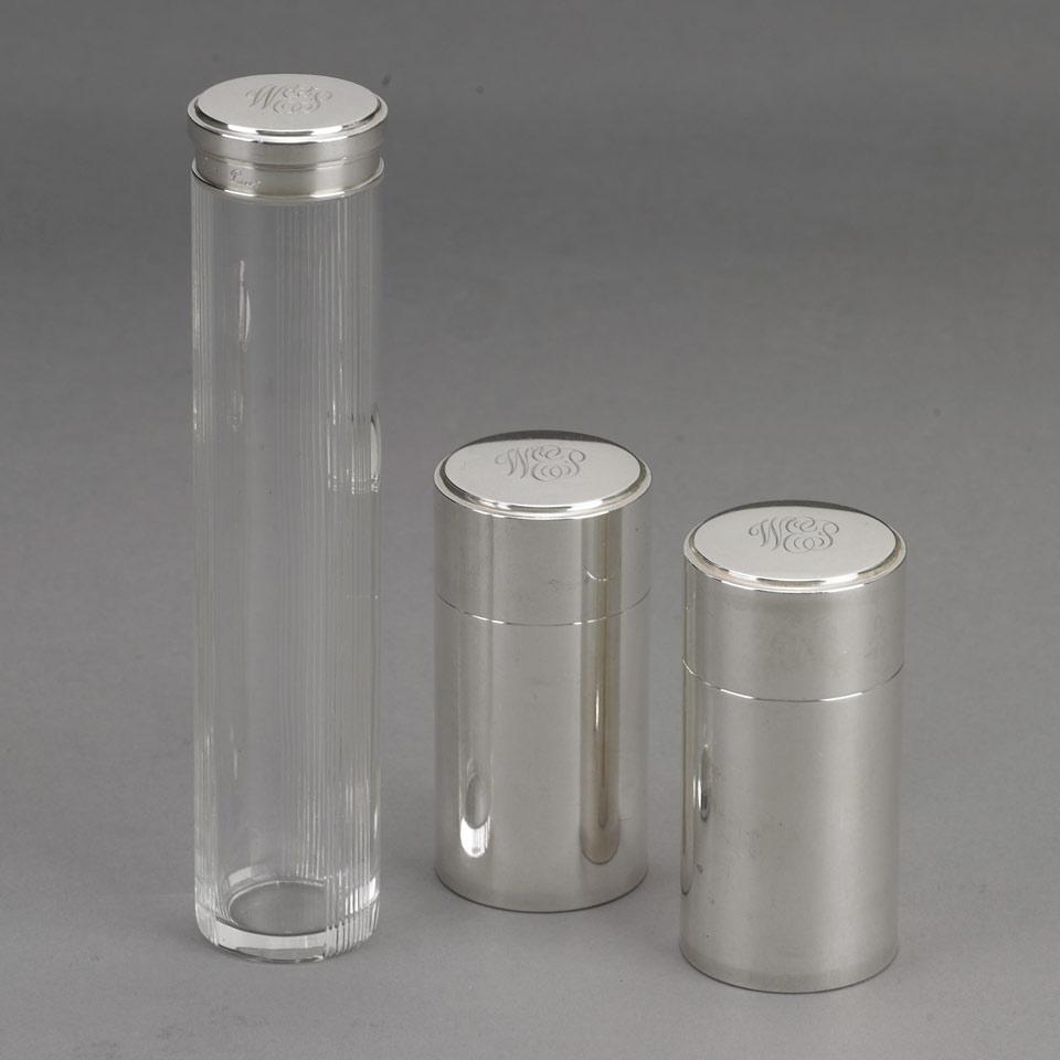 Three French Silver Traveling Toilet Containers, Cartier, Paris, early 20th century