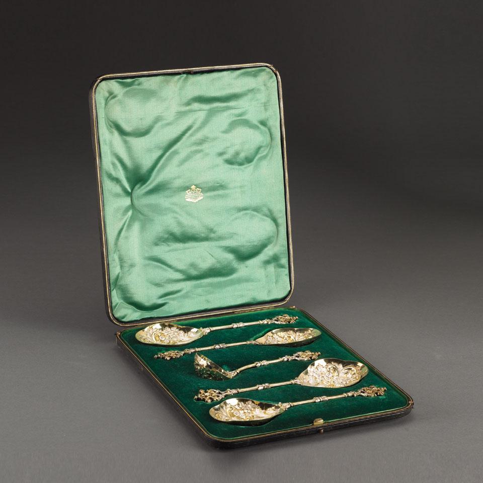 Four Victorian Silver and Parcel Gilt Berry Spoons and a Sugar Sifter, William Gibson & John Langman, London, 1897